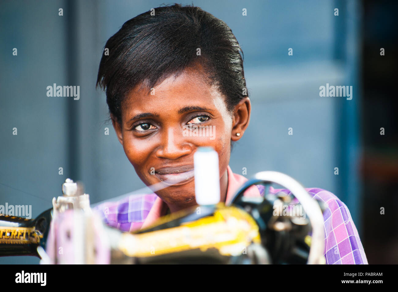 GHANA MARCH 2, 2012 Unindentified Ghanaian woman works with a sewing