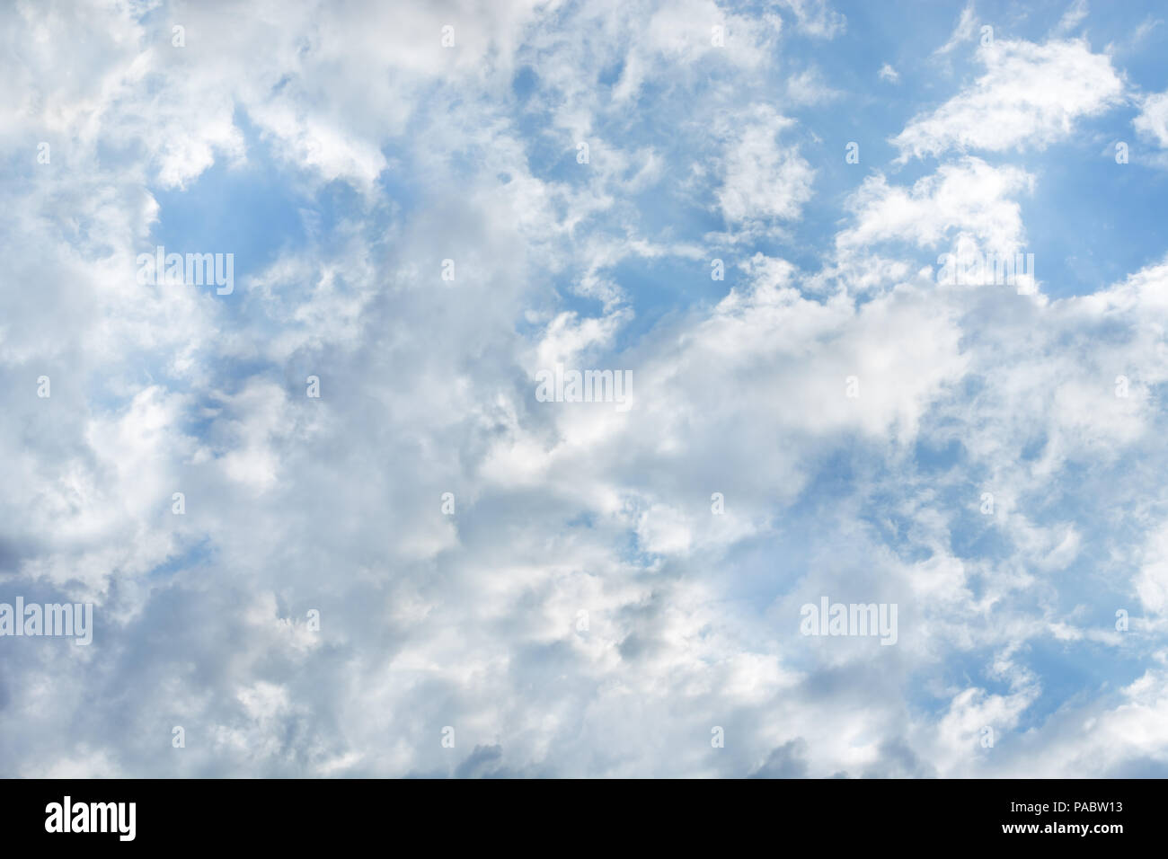 Beautiful sunlit clouds in the blue sky Stock Photo