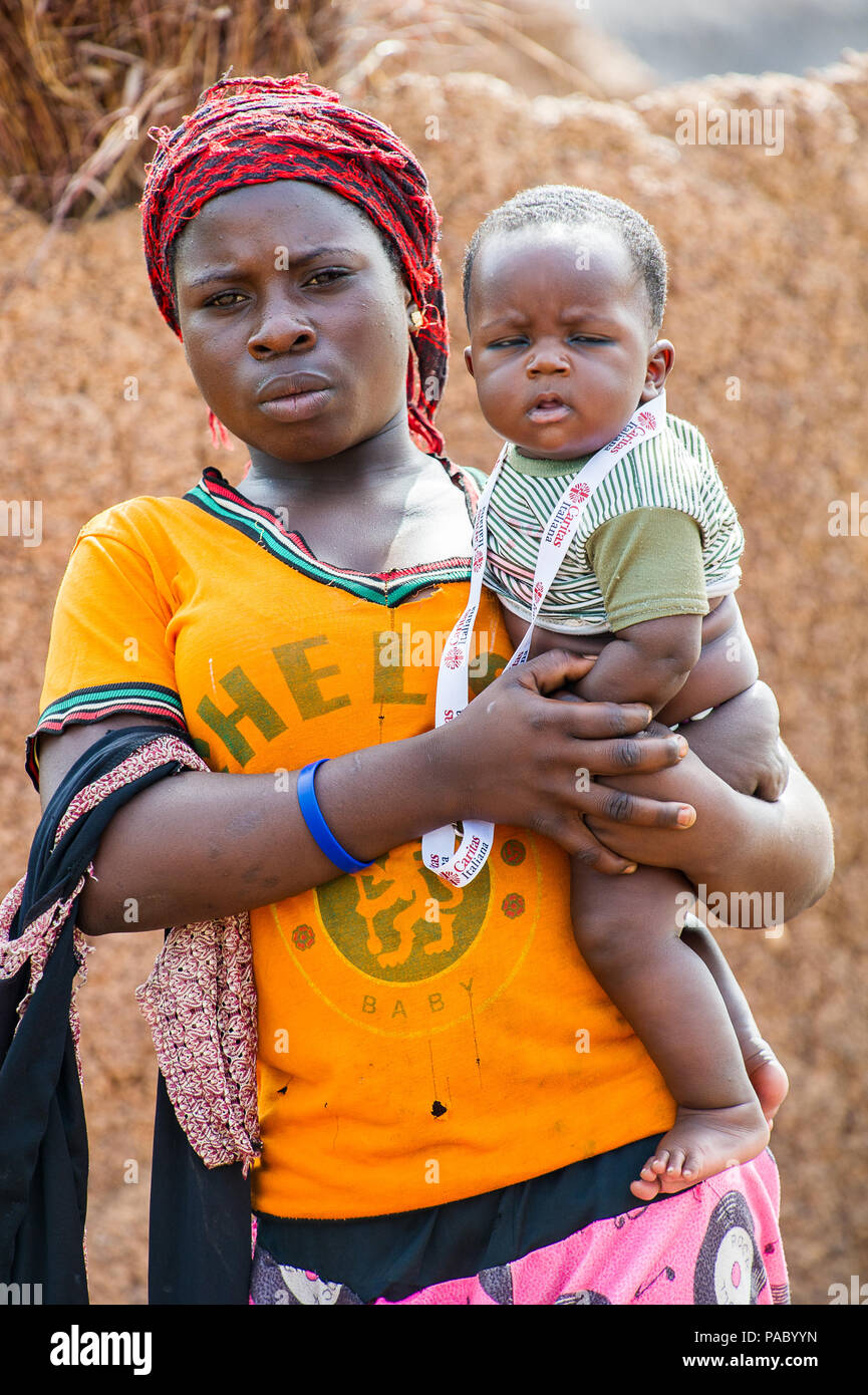 ACCRA, GHANA - MARCH 6, 2012: Unidentified Ghanaian mother hold her ...