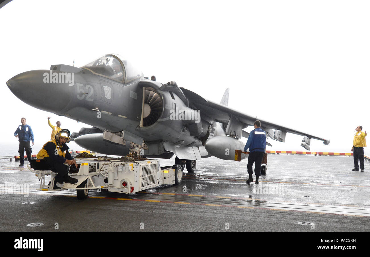 160306-N-GV721-013 PACIFIC OCEAN (March 6, 2016) “We help the Marines maintain the readiness of their aircraft to be able to complete operations,” said Aviation Boatswain’s Mate (Handling) 3rd Class Terrell Silver. Silver moves an AV-8B Harrier II to the portside aircraft elevator with an A/S32A-49 tow tractor aboard amphibious assault ship USS Boxer (LHD 4). More than 4,500 Sailors and Marines from the Boxer Amphibious Ready Group, 13th Marine Expeditionary Unit (13th MEU) team are currently transiting the Pacific Ocean in the U.S. 7th Fleet area of operations during a scheduled deployment. ( Stock Photo