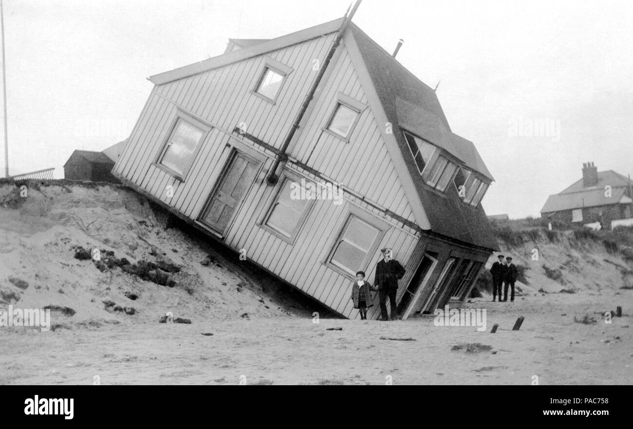 Damage after the flood, residential house slid down the embankment, 1920s, USA Stock Photo