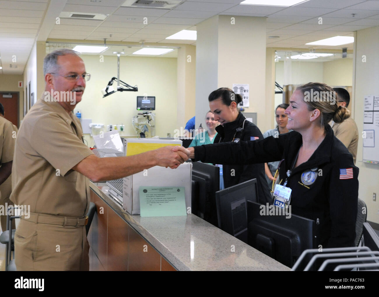 160308-N-UM054-123  MARINE CORPS BASE CAMP PENDLETON, Calif (March 8, 2016)  Rear Adm. Bruce A. Gillingham, Commander, Navy Medicine West, greets Lt. j.g. Micah Kosemund, a registered nurse at Naval Hospital Camp Pendleton, in the Emergency Room during a hospital visit and tour March 8, 2016.  During his visit, Gillingham held an Admiral's call, presented awards and coins to staff members and attended a luncheon with invited civillians and sailors.  The visit was a part of a larger visit aboard Marine Corps Base Camp Pendleton.  (U.S. Navy Photo by Mass Communication Specialist 2nd Class Yasmi Stock Photo