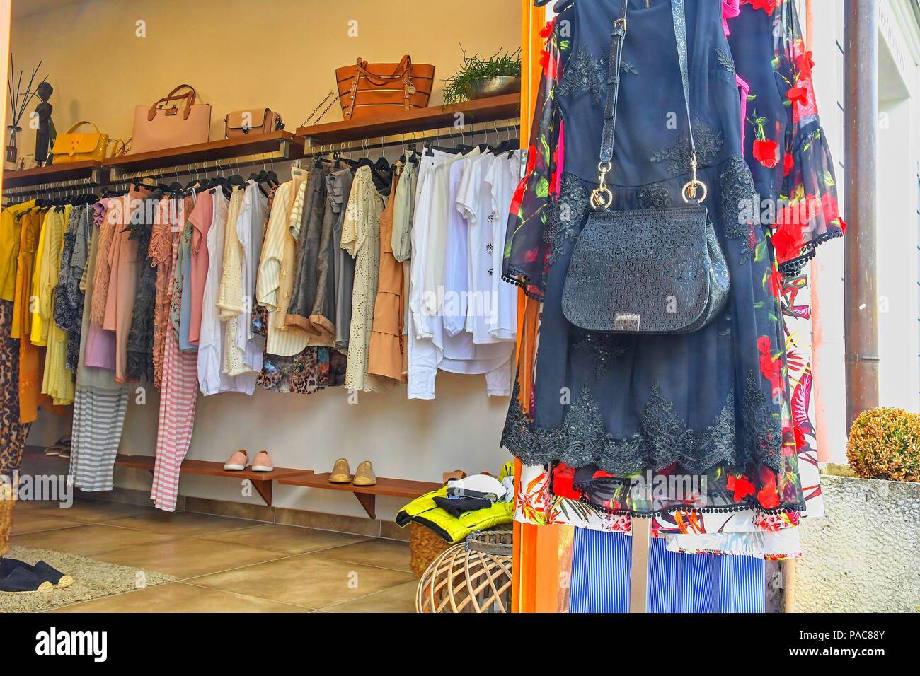 Clothing on hanger at the modern shop boutique Stock Photo Alamy