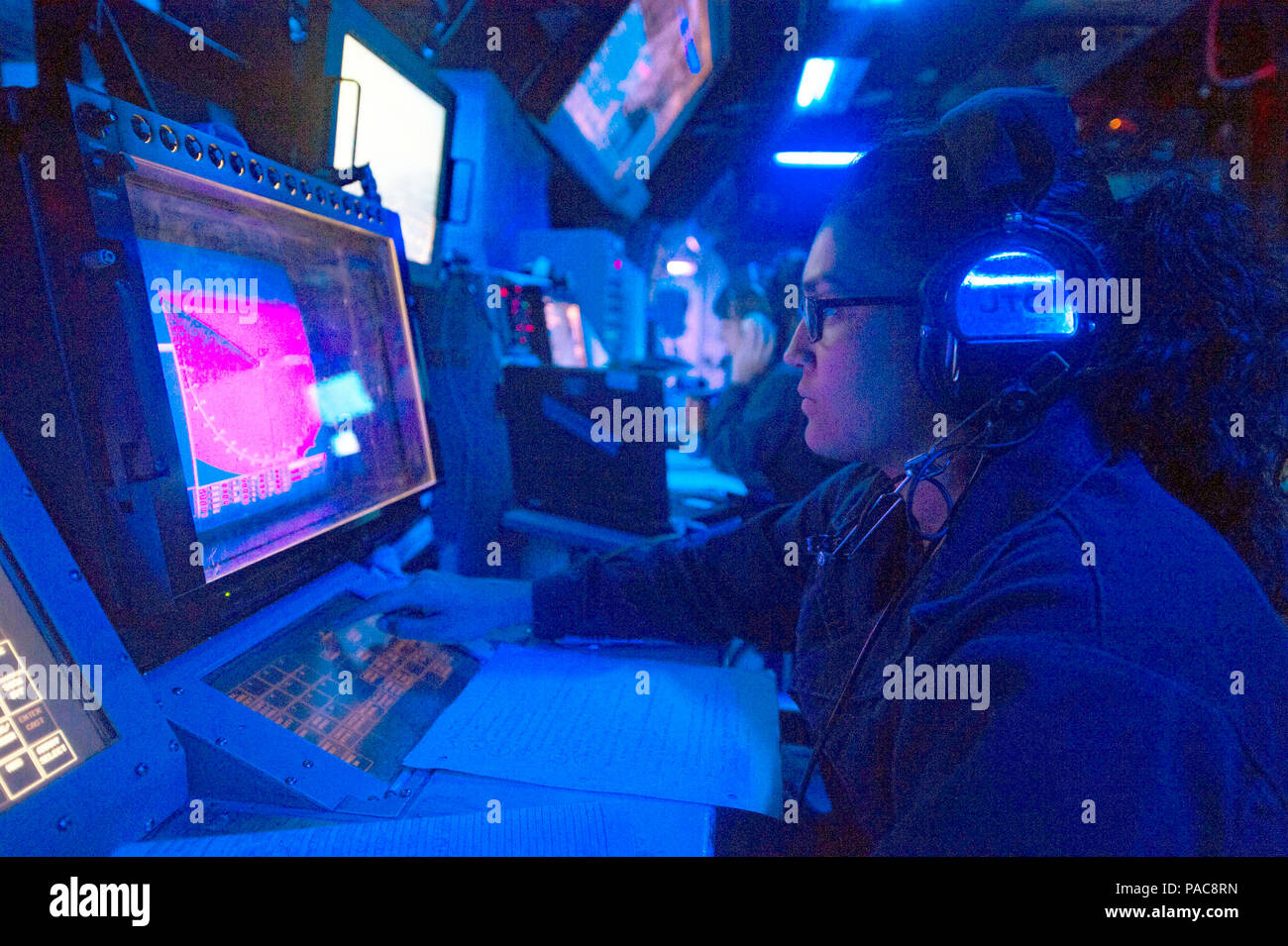 160308-N-MD297-001 PACIFIC OCEAN (March 8, 2016) - Operations Specialist Seaman Apprentice Amanda Parker stands watch in the combat information center (CIC) aboard the Arleigh Burke-class guided-missile destroyer USS Lassen (DDG 82). Lassen is deployed to the U.S. 4th Fleet area of responsibility supporting law enforcement operations as part of Operation Martillo. (U.S. Navy photo by Mass Communication Specialist 2nd Class Huey D. Younger Jr./Released) Stock Photo