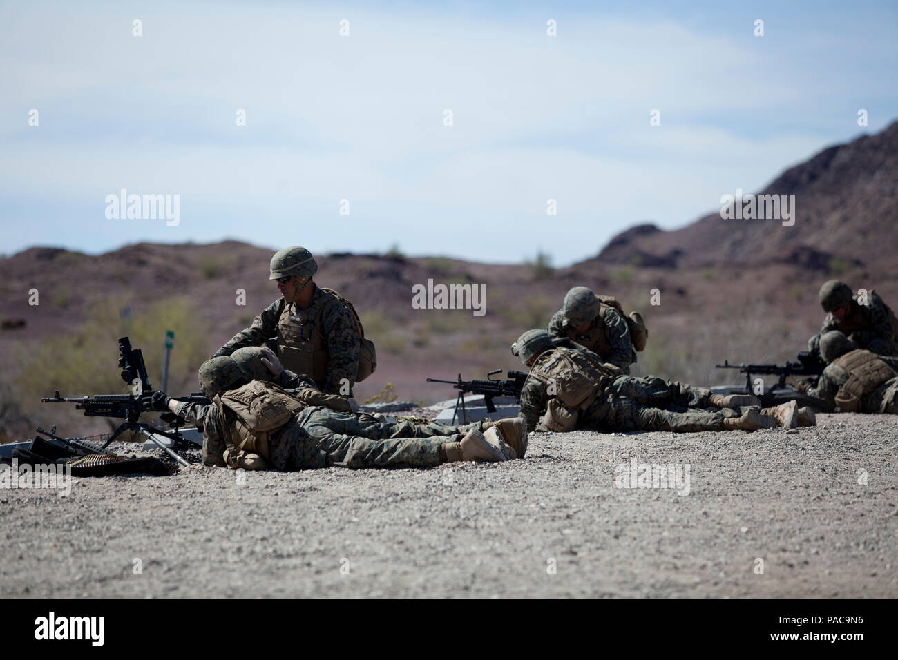 U.S. Marines, Marine Wing Support Squadron 371 (MWSS-371), Marines fire a M240B machine gun at Yuma Proving Grounds, Ariz., on March 10, 2016. MWSS-371 conducts an annual field exercise to prepare Marines for future deployments. (U.S. Marine Corps photo by Lance Cpl. AaronJames B. Vinculado/ Released) Stock Photo