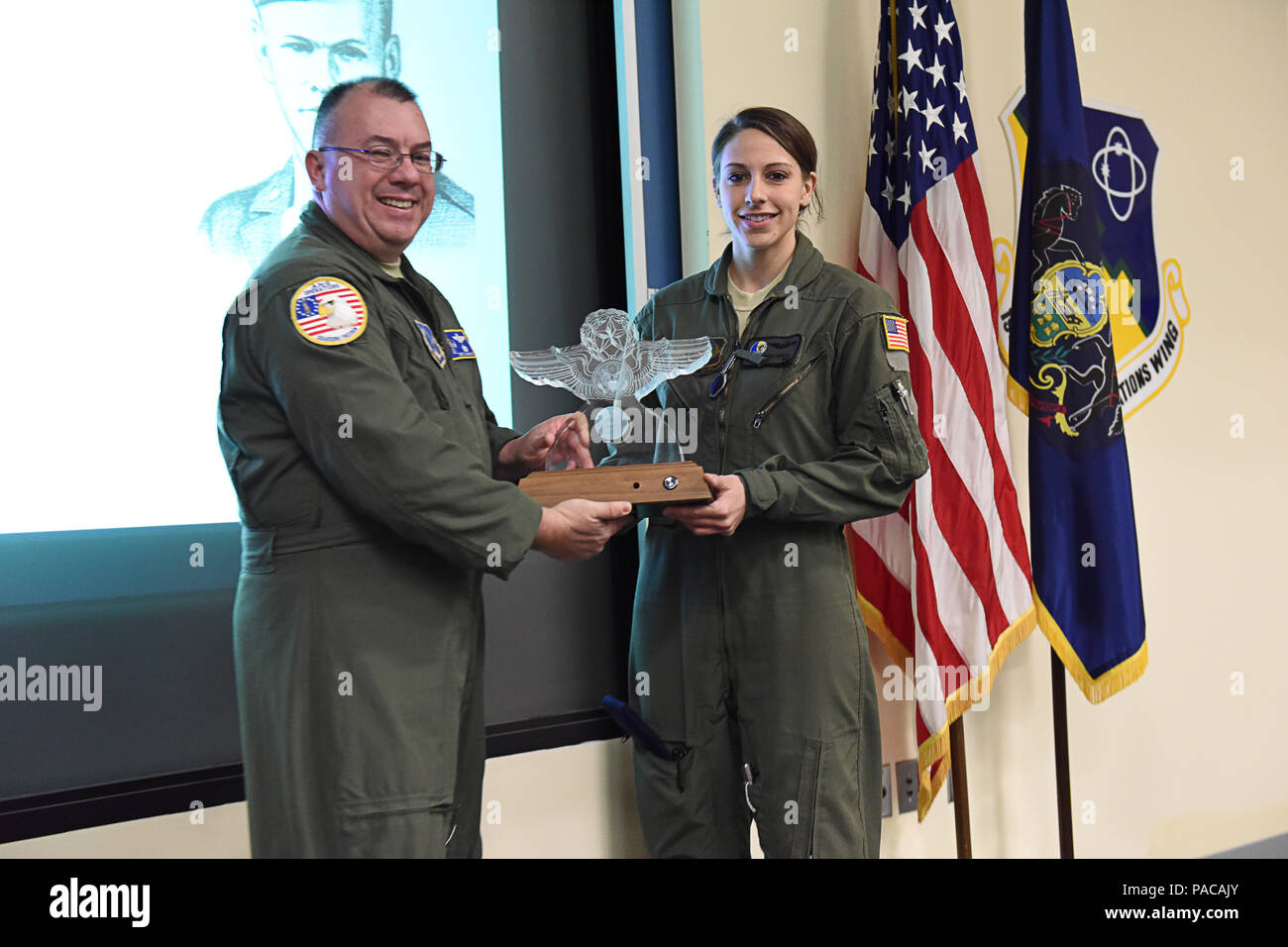 staff-sgt-nicole-m-gentzel-right-airborne-mission-systems-specialist-at-the-193rd-special-operations-wing-middletown-pa-receives-the-red-erwin-award-march-12-gentzel-competed-against-many-other-air