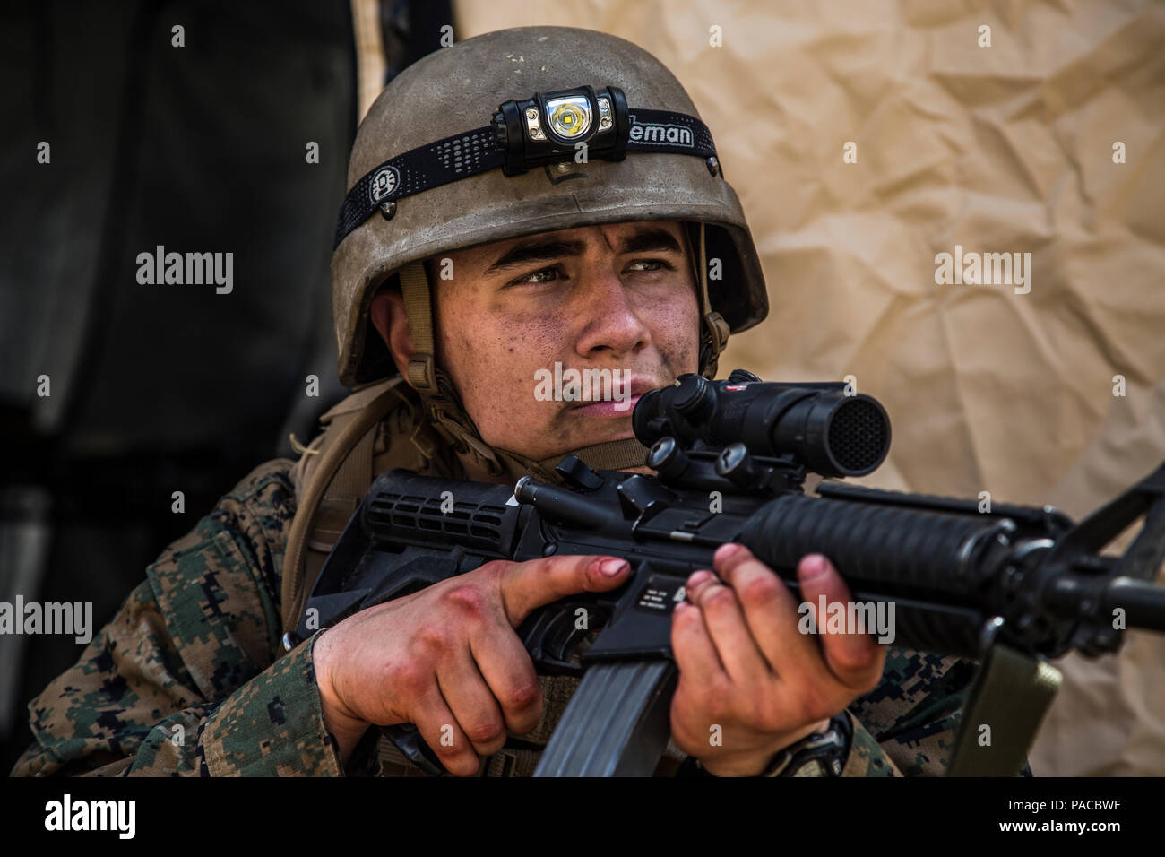 A U.S. Navy Corpsman assigned to Field Medical Training Battalion East (FMTB-E), provides security during a final exercise (FINEX) at Camp Johnson, N.C., March 2, 2016. FINEX is a culminating event at FMTB-E which transitions Sailors into the Fleet Marine Force. (U.S. Marine Corps photo by Sgt. James R. Skelton/Released) Stock Photo