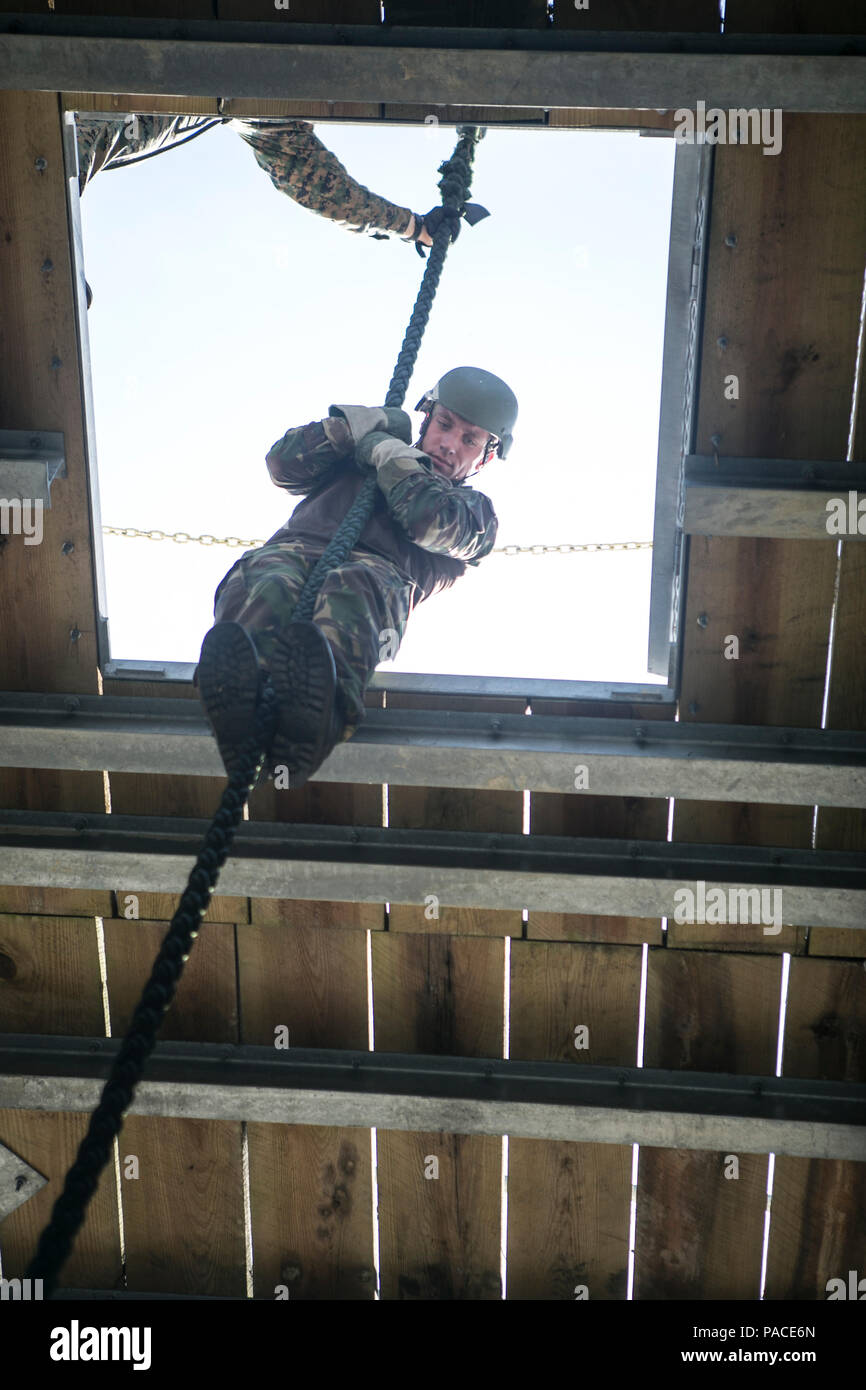 Tactical Rope Operators A Royal Netherlands Marine fast ropes down a tower at Stone Bay, Camp ...