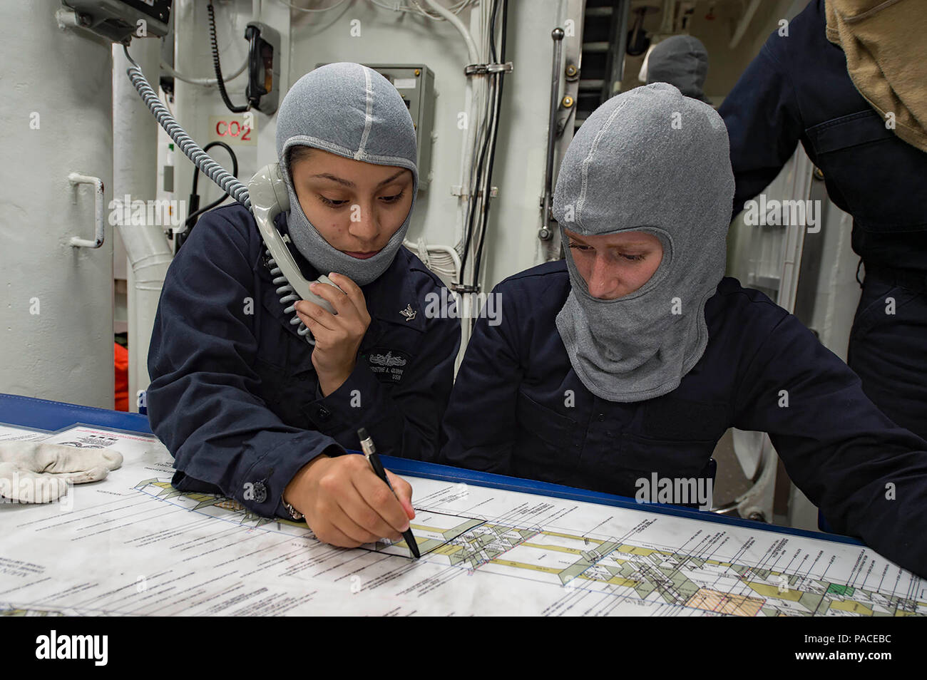160311-N-MD297-088 PACIFIC OCEAN (March 11, 2016) - Yeoman Seaman Christine Quinn, left, and Gas Turbine Systems Technician (Mechanical) Fireman Dickie updates a damage control chart during a main space fire drill aboard the Arleigh Burke-class guided-missile destroyer USS Lassen (DDG 82). Lassen is deployed to the U.S. 4th Fleet area of responsibility supporting law enforcement operations as part of Operation Martillo. (U.S. Navy photo by Mass Communication Specialist 2nd Class Huey D. Younger Jr./Released) Stock Photo