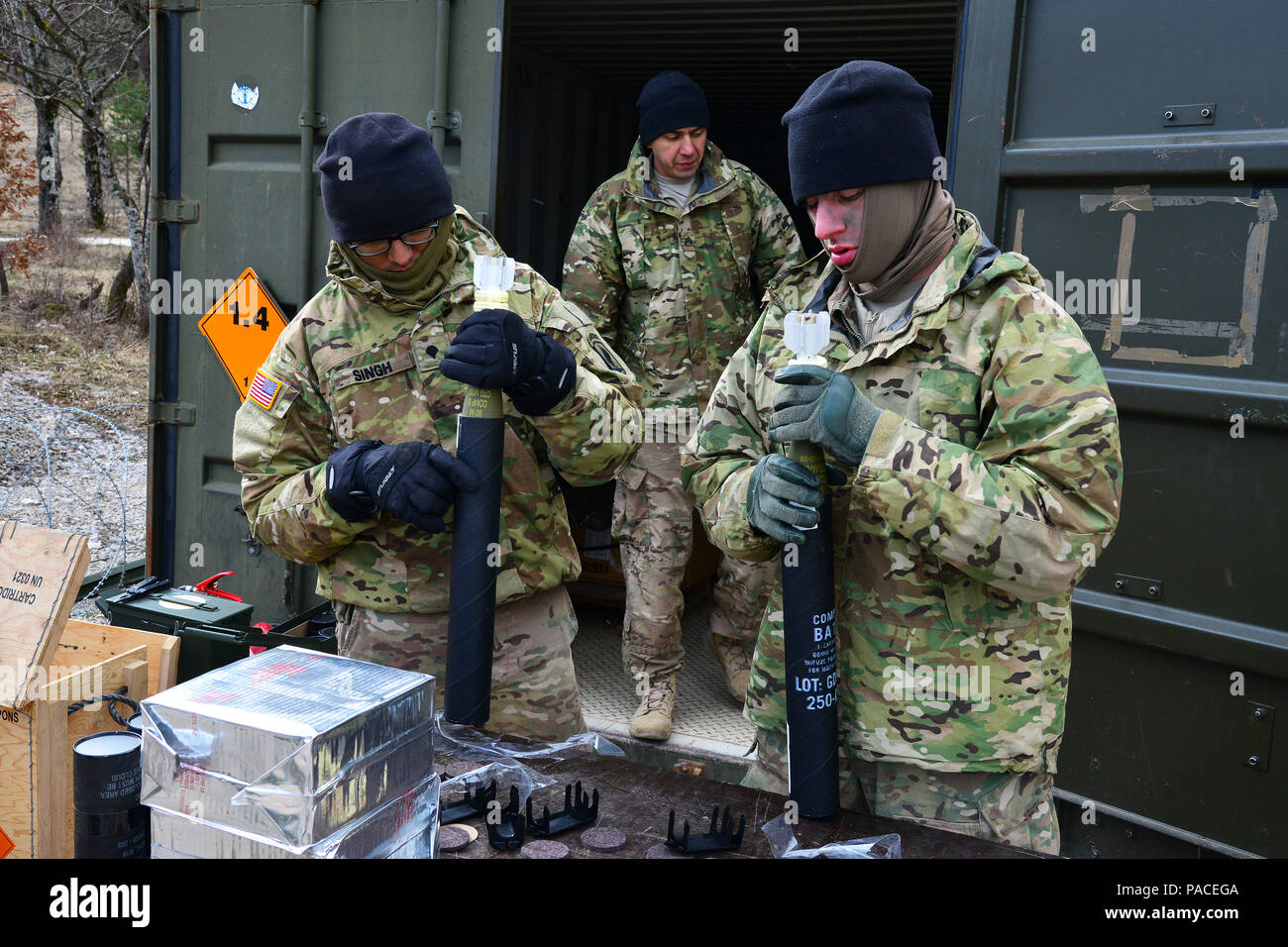 U.S. Army Spc. Ranjodh Singh and Pfc. Jessy Manley, paratroopers assigned to 2nd Battalion, 503rd Infantry Regiment, 173rd Airborne Brigade, prepare 60mm mortar rounds for a live-fire exercise as part of Exercise Rock Sokol at Pocek Range in Postonja, Slovenia, March 16, 2016. Exercise Rock Sokol is a bilateral training exercise between the U.S. Army 173rd Airborne Brigade and the Slovenian Armed Forces, focused on small-unit tactics and building on previous lessons learned, forging the bonds and enhancing readiness between allied forces. The 173rd Airborne Brigade is the U.S. Army's Contingen Stock Photo