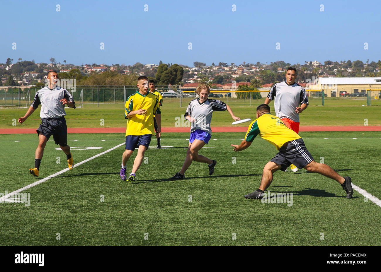 Participants in the Commanding General’s Cup Ultimate Frisbee Tournament compete against each other at the track and field area on Marine Corps Recruit Depot San Diego, March 15. Each match consisted of two rounds including a three-minute break during half time. Stock Photo