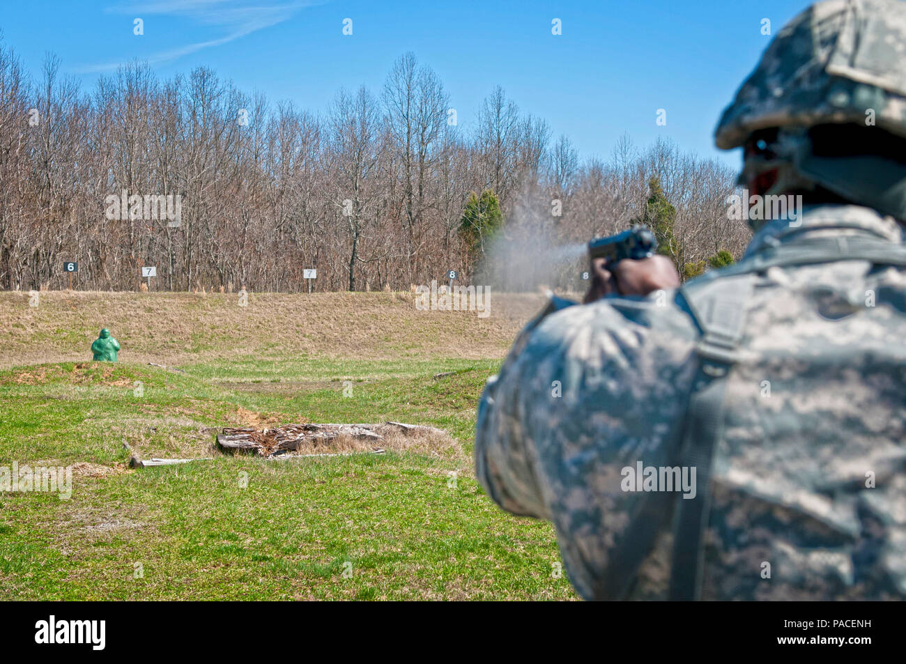 Sgt. Edward Taylor, with the 444th Human Resources Company, shoots a pop-up target with a Beretta M9 pistol during the 316th Sustainment Command (Expeditionary) Best Warrior Competition at Fort Knox, Ky., March 16, 2016. (U.S. Army photo by Staff Sgt. Dalton Smith/Released) Stock Photo