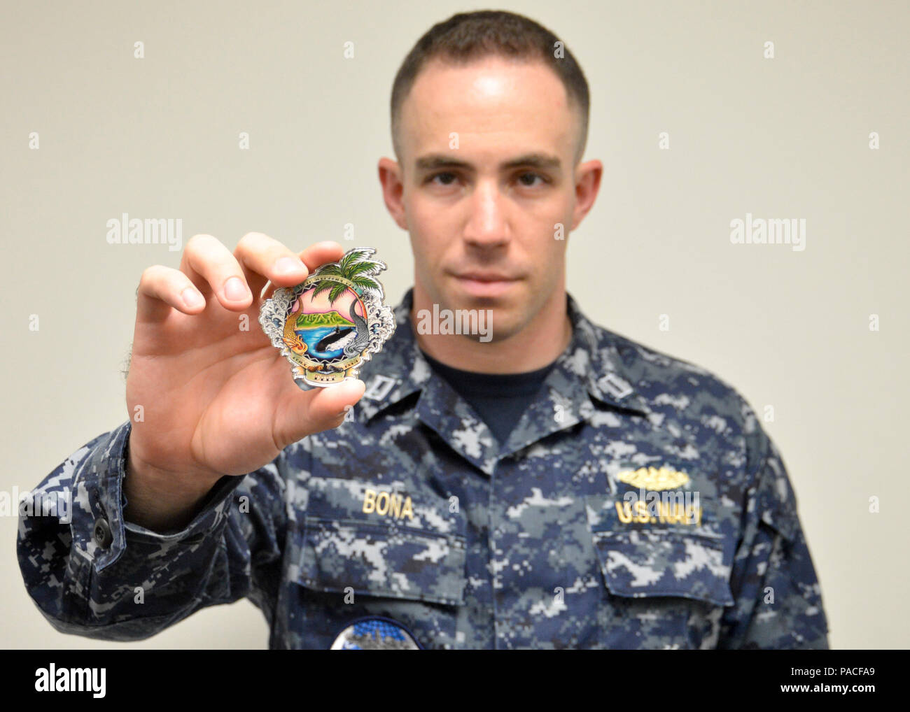 Lieutenant Nick Bona presents the 116th Pacific Fleet Submarine Force ...