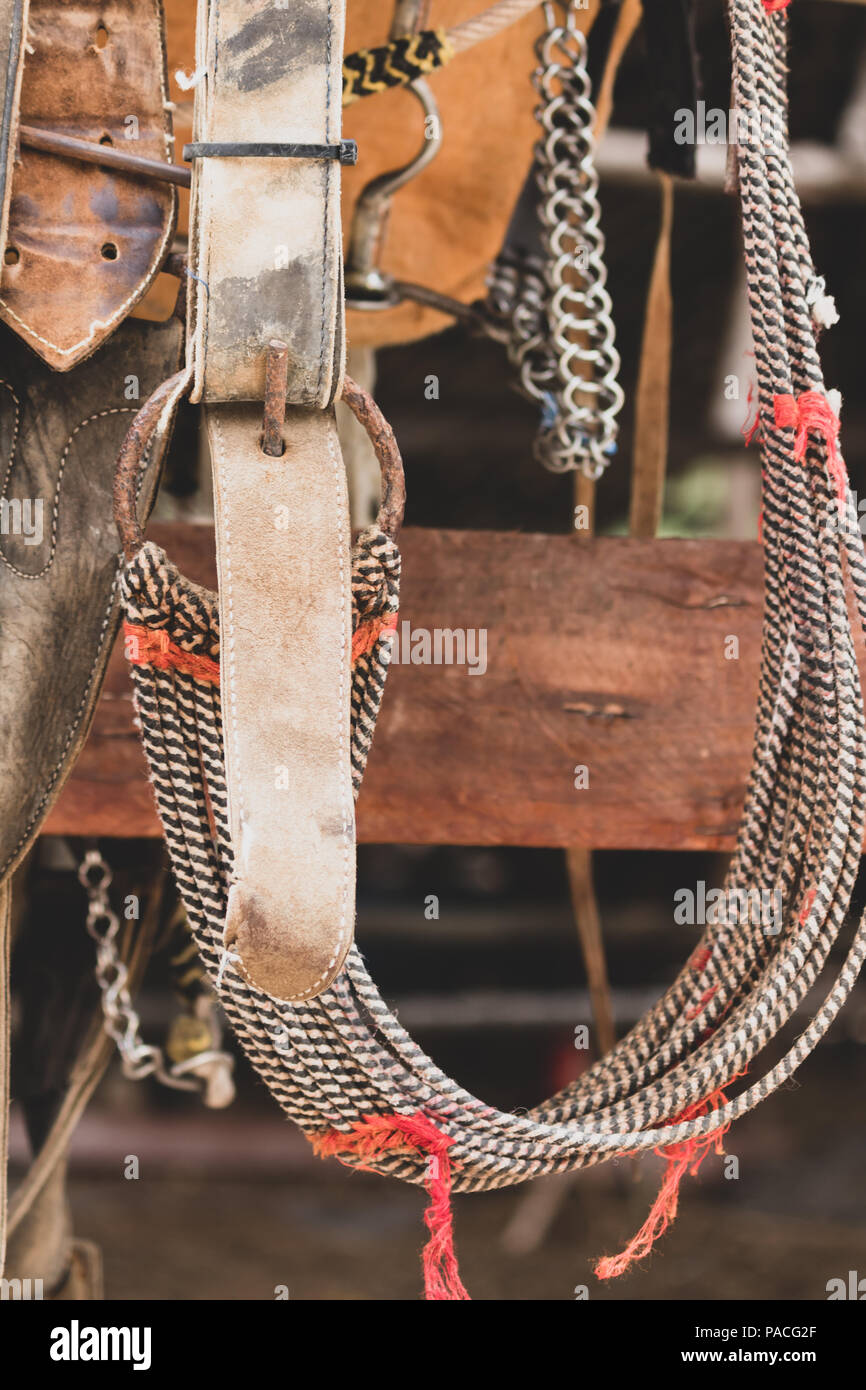 rustic horse saddle. This worn out leather saddle shows years of intense use Stock Photo Alamy
