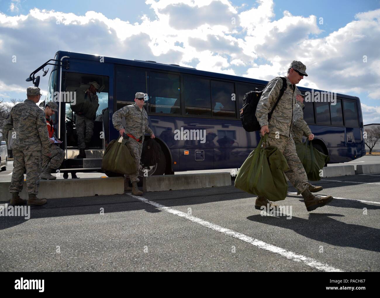 U S Air Force Airmen Step Off A Bus To Go Into The Mock Personnel Deployment Function At Misawa Air Base Japan March 15 2016 The Pdf Ensures Airmen Have All Pre Deployment Paperwork