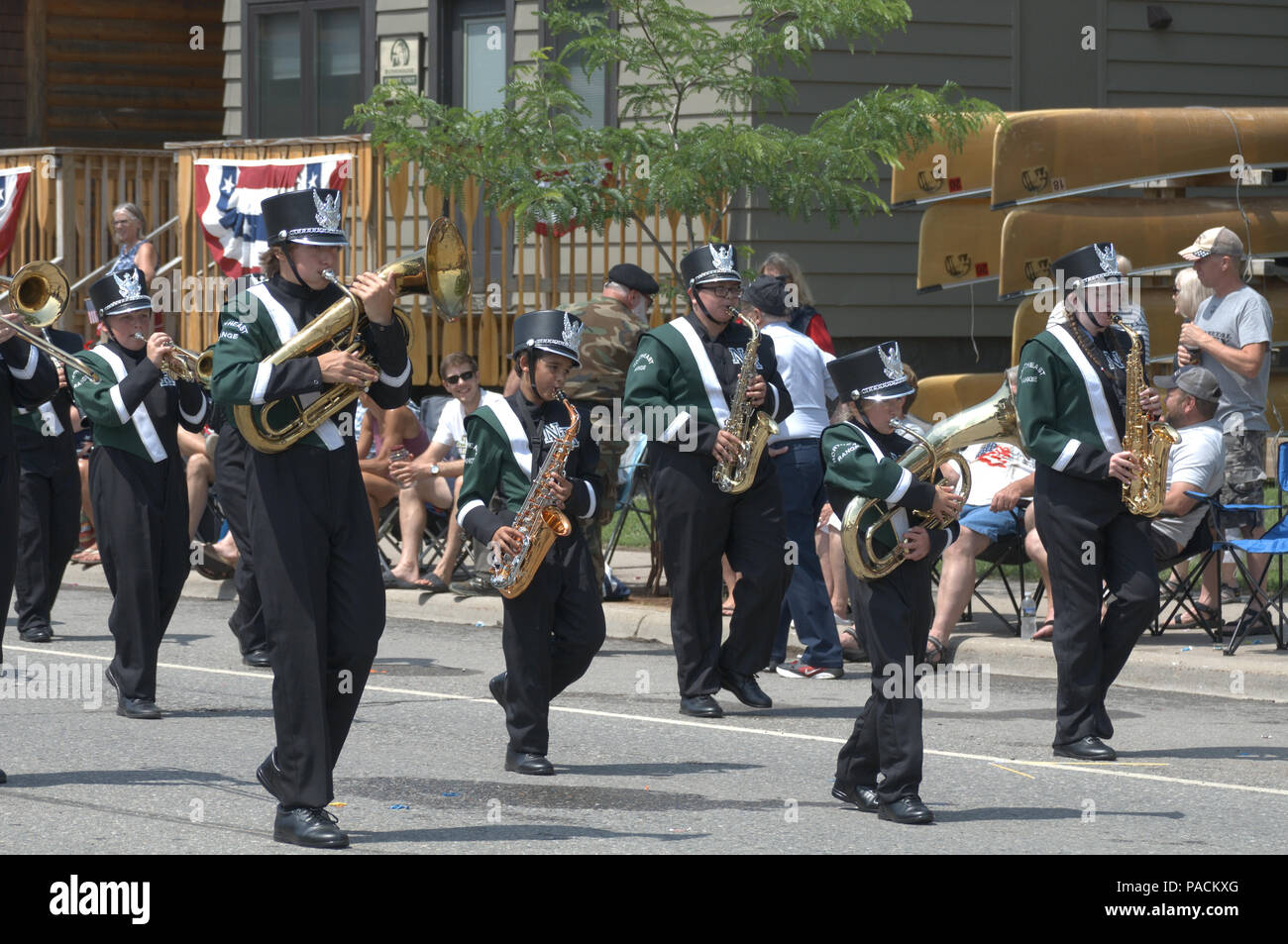 A high school marching band participates in a July 4th parade in Ely