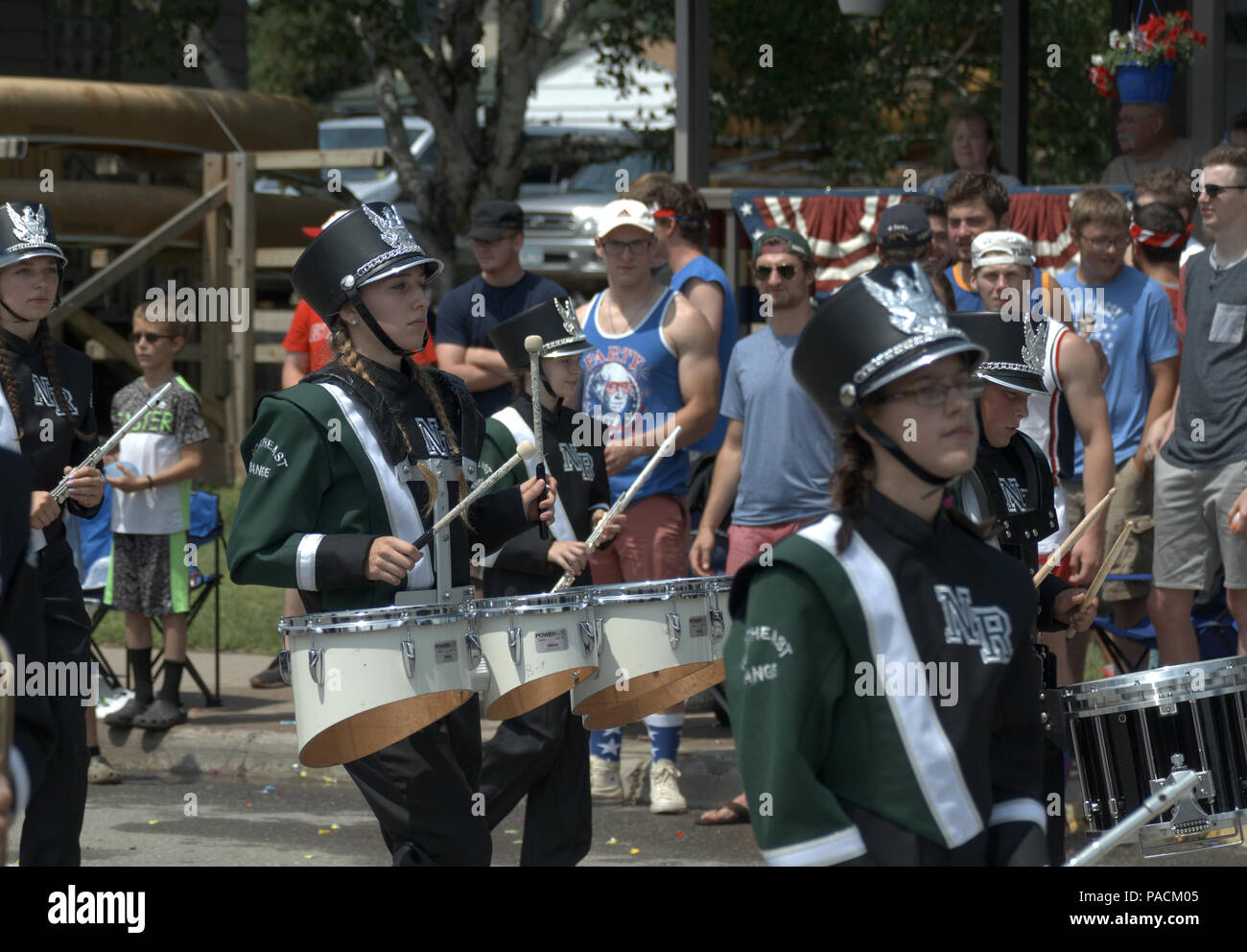 A high school marching band participates in a July 4th parade in Ely