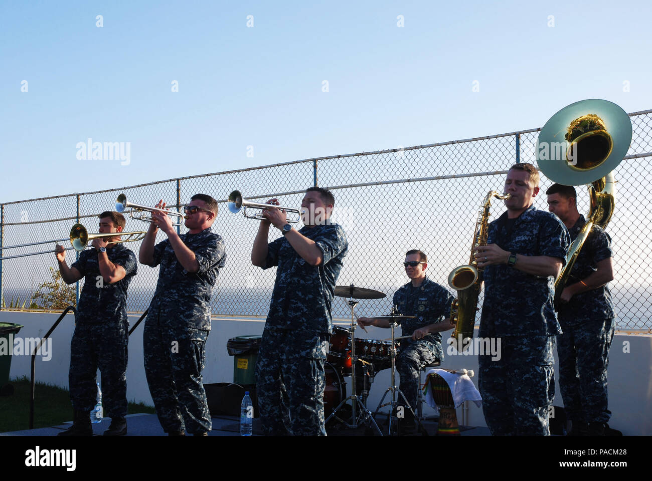 160318-N-ZZ999-014 DAKAR, Senegal (March 18, 2016) The U.S. Naval Forces Europe Brass Band performs at Ebbet’s field in Dakar, Senegal for embassy staff and their families during exercise Obangame/Saharan Express 2016, March 18. Obangame/Saharan Express, one of three African regional express series exercises facilitated by U.S. Naval Forces Europe-Africa/U.S. 6th Fleet, seeks to increase regional cooperation, maritime domain awareness, information sharing practices and improve interoperability among participating forces in order to enhance maritime security and regional economic stability. (U. Stock Photo