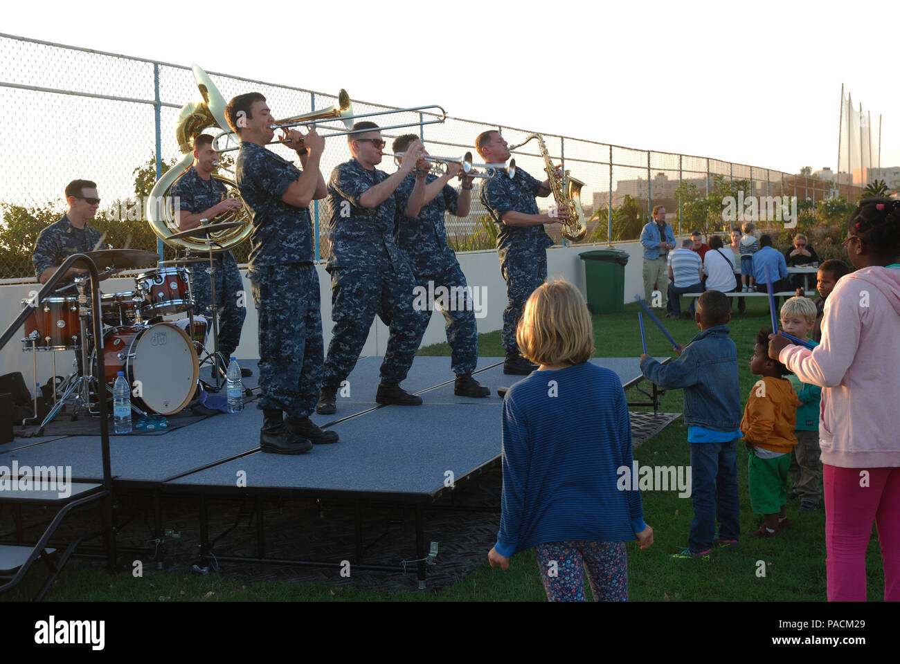 160318-N-ZZ999-093 DAKAR, Senegal (March 18, 2016) The U.S. Naval Forces Europe Brass Band performs at Ebbet’s field in Dakar, Senegal for embassy staff and their families during exercise Obangame/Saharan Express 2016, March 18. Obangame/Saharan Express, one of three African regional express series exercises facilitated by U.S. Naval Forces Europe-Africa/U.S. 6th Fleet, seeks to increase regional cooperation, maritime domain awareness, information sharing practices and improve interoperability among participating forces in order to enhance maritime security and regional economic stability. (U. Stock Photo