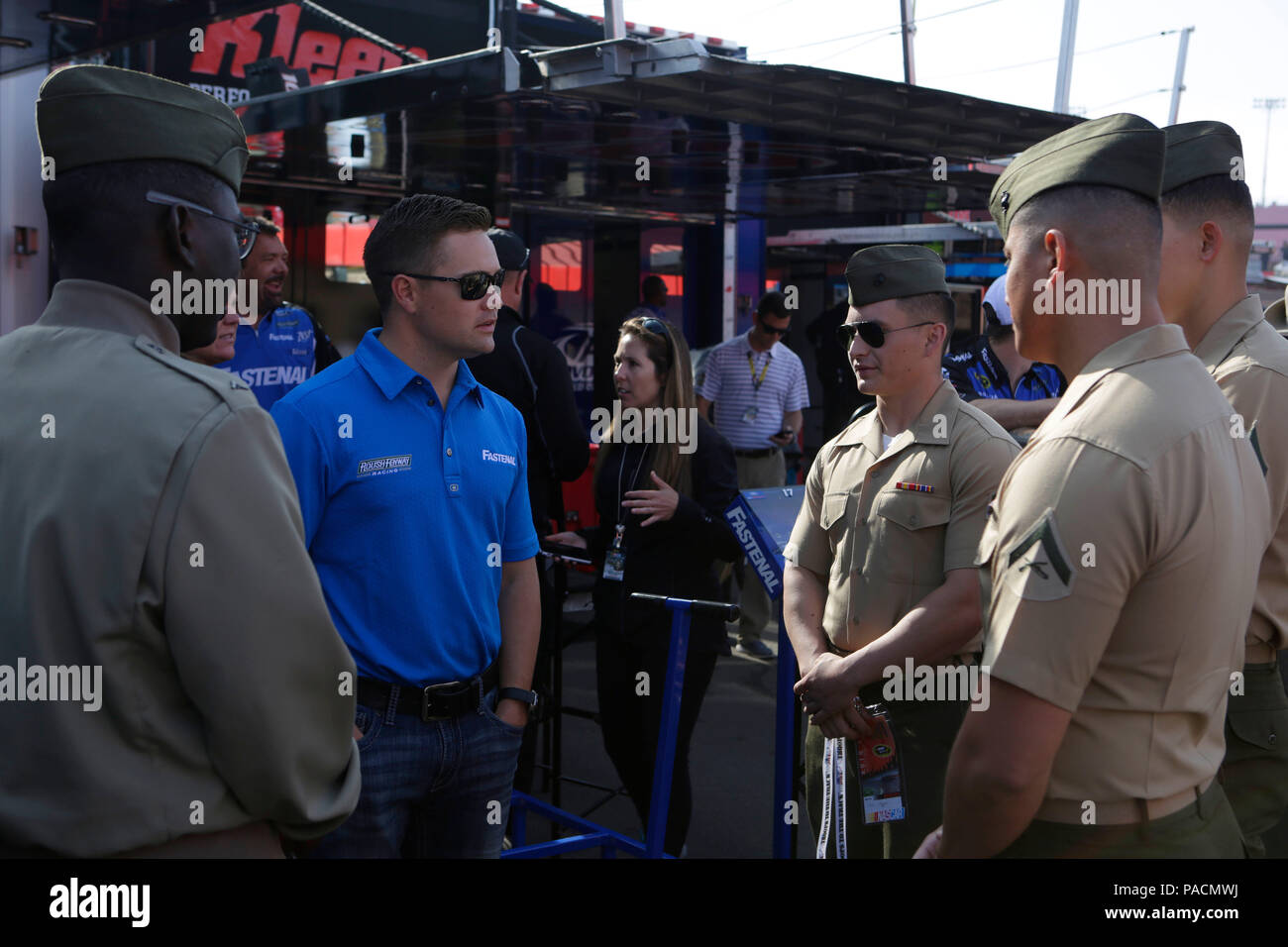 Ricky Stenhouse Jr., the driver of the No. 17 Fastenal Ford, meets with Marines from Camp Pendleton at the Auto Club Speedway in Fontana, Calif., March 21, 2016. Marines were given the opportunity to meet several drivers and celebrities during the NASCAR Sprint Cup Series Auto 400 race. (Marine Corps Photo by Lance Cpl. Emmanuel Necoechea/Released) Stock Photo