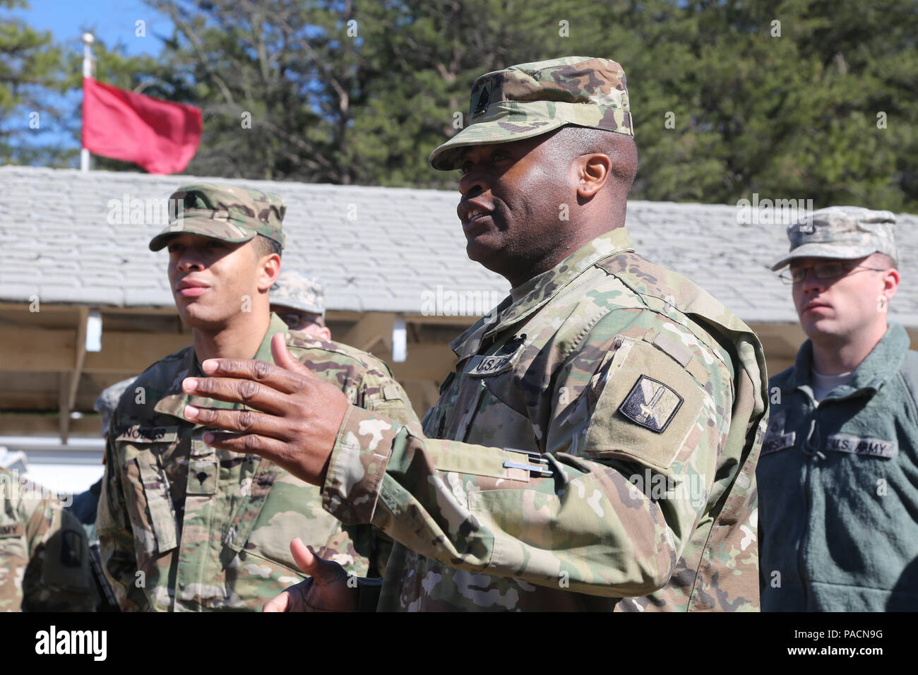 U.S. Army Command Sgt. Maj. Timothy Coleman, assigned to 114th Signal Battalion, speaks on behalf of Sgt. Samuel Nobles promotion at Fort George G. Meade, Md., March 2, 2016. The promotion from specialist to sergeant marks the responsibility instilled into the new noncommissioned officer. (U.S. Army photo by Spc. Alyssa Madero/Released) Stock Photo