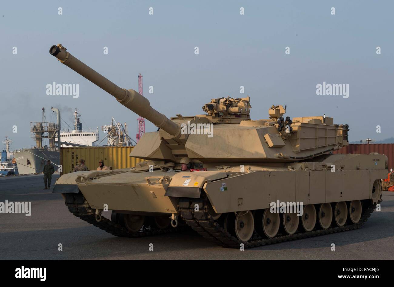 160314-N-RM689-042  GWANGYANG, Republic of Korea (Mar. 14, 2016)- An M1A1 Abram tank attached to Delta Company 1st Tank Battalion, 1st U.S. Marine Division drives into position on the pier to be lifted by two cranes onto amphibious dock landing ship USS Ashland (LSD 48) to prepare for the Assault Follow-On Echelon (AFOE) portion of Ssang Yong 16. Ashland is assigned to the Bonhomme Richard Expeditionary Strike Group and is participating in Ssang Yong 16, a biennial combined amphibious exercise conducted by forward-deployed U.S. forces with the Republic of Korea Navy and Marine Corps, Australia Stock Photo
