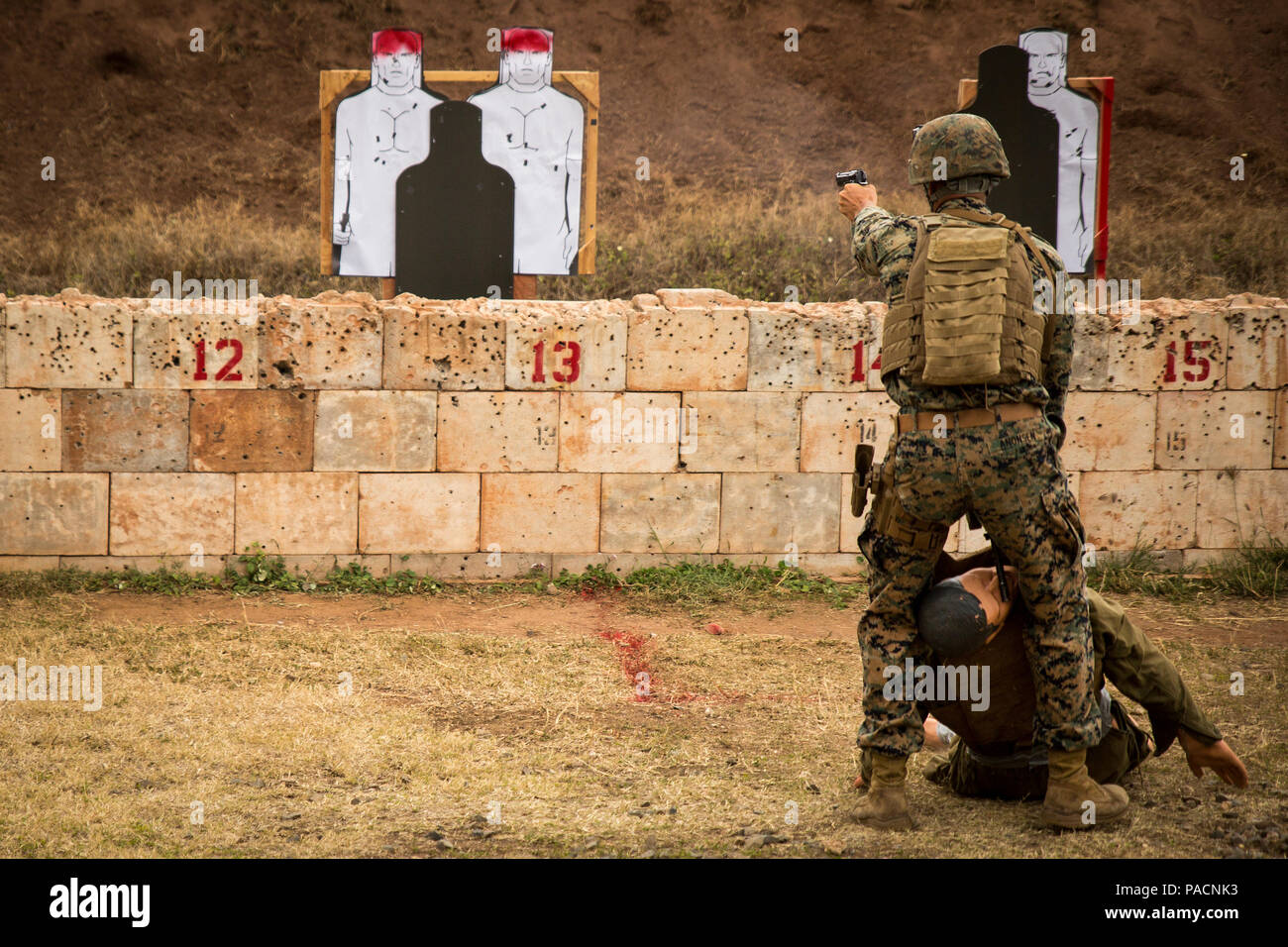 Sgt. Dalton Anonsen engages targets while dragging a casualty