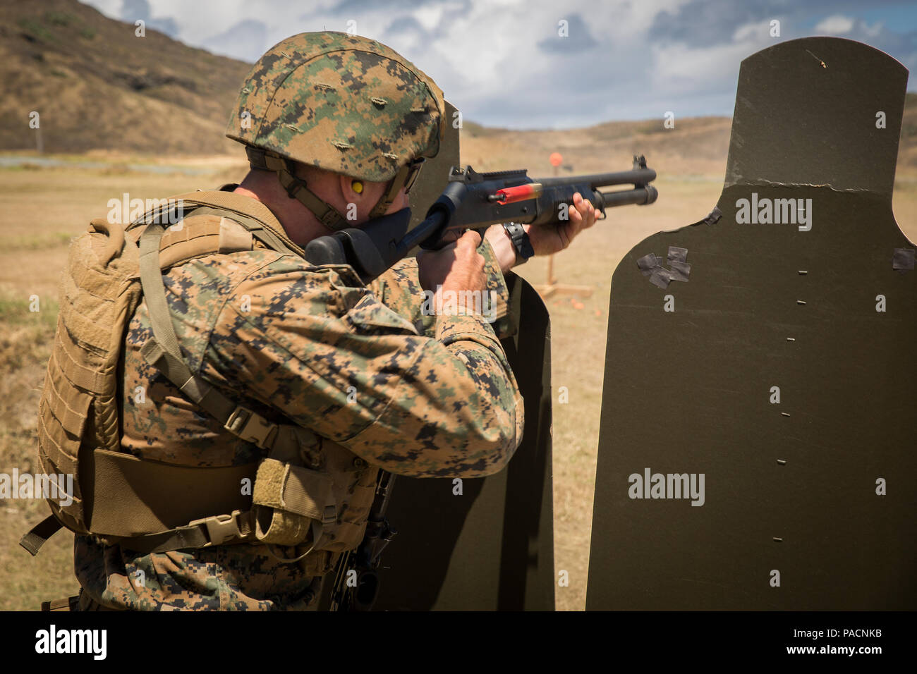 Sgt. Clayton Abbott engages targets with an M1014 shotgun during a 
