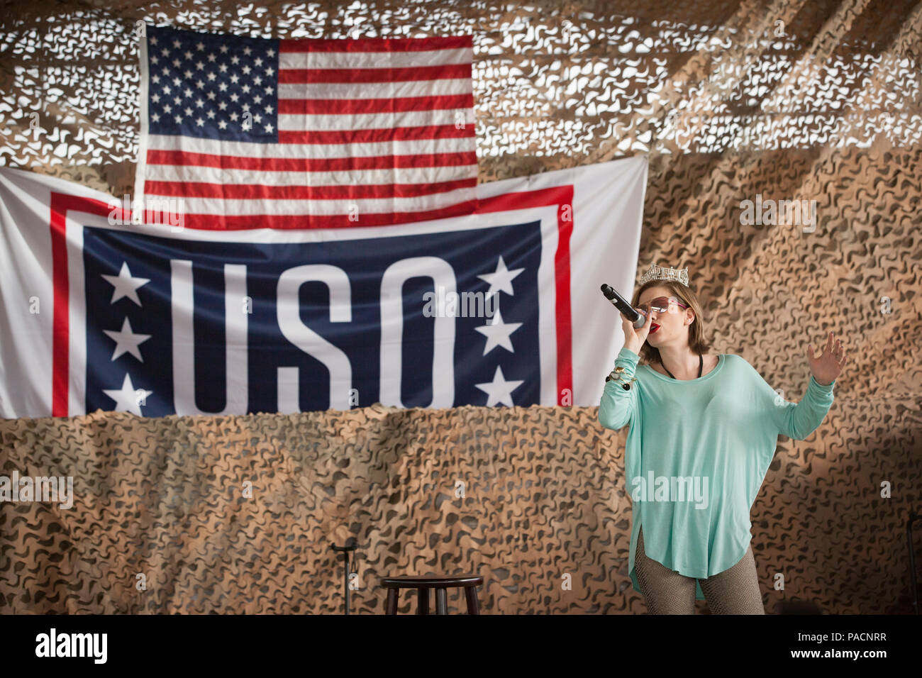 Miss America Betty Cantrell sings “Georgia on My Mind” during the USO Spring 2016 Entertainment Tour at the Baghdad Diplomatic Support Center (BDSC) in Baghdad, Iraq, March 15, 2016. The tour also featured country singer Craig Morgan, UFC fighters Donald “Cowboy” Terrone and Anthony Pettis, and Carolina Panthers football player Charles “Peanut” Tillman. (U.S. Army photo by Staff Sgt. Sergio Rangel/RELEASED) Stock Photo