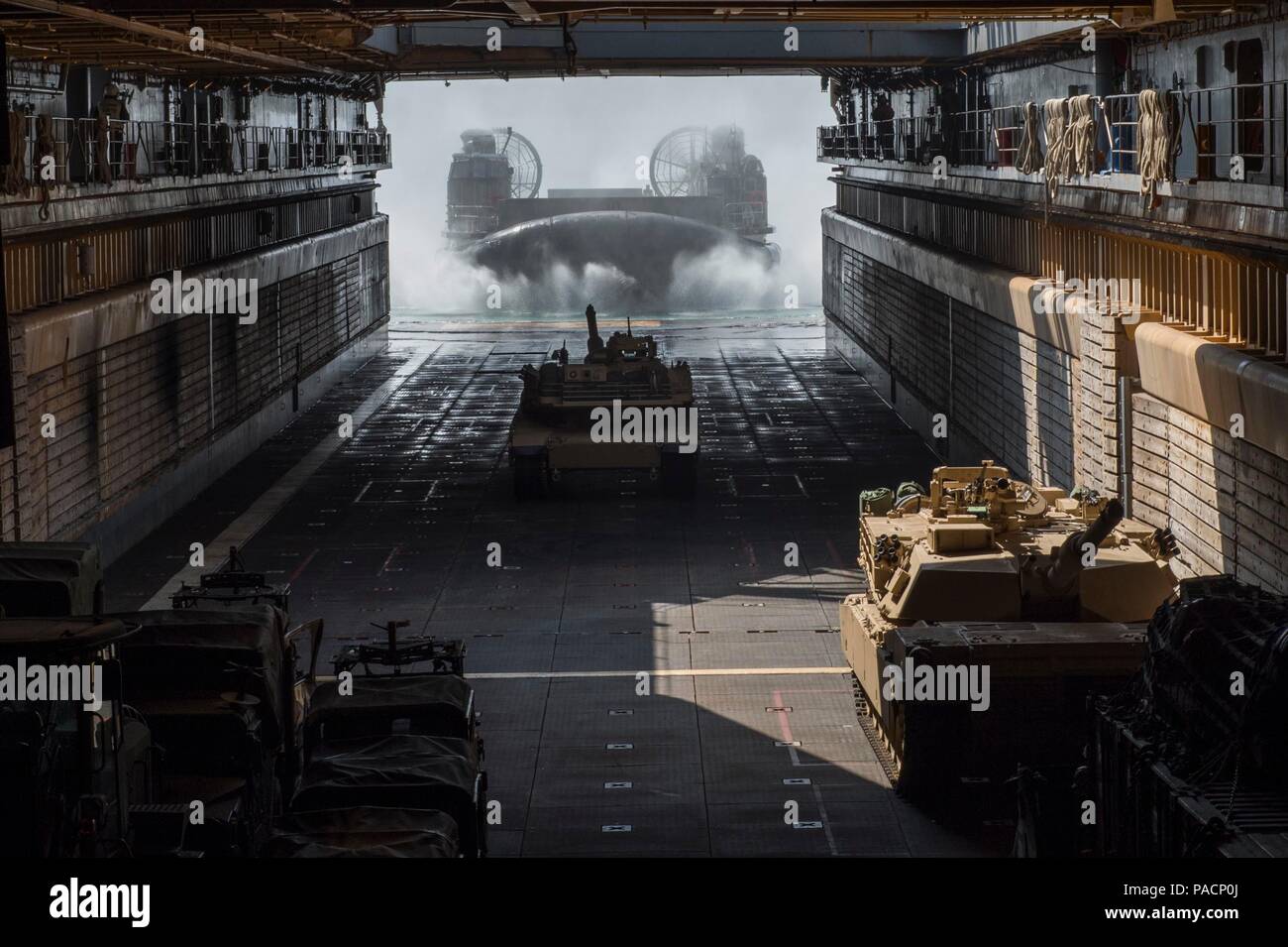 160315-N-RM689-059 EAST SEA (March 15, 2016) - A landing craft air cushion (LCAC) approaches the well deck of amphibious dock landing ship USS Ashland (LSD 48) to load an M1A1 Abram tank attached to Delta Company 1st Tank Battalion, 1st U.S. Marine Division for the Assault Follow-On Echelon (AFOE) portion of Ssang Yong 16. Ashland is assigned to the Bonhomme Richard Expeditionary Strike Group and is participating in Ssang Yong 16, a biennial combined amphibious exercise conducted by forward-deployed U.S. forces with the Republic of Korea navy and Marine Corps, Australian army and Royal New Zea Stock Photo