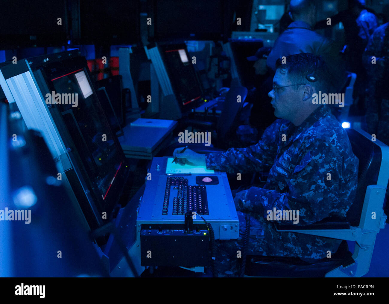160322-N-DI878-070 (March 22, 2016) SAN DIEGO – USS Carl Vinson (CVN 70) Air Traffic Controller 1st Class  David Shoemaker demonstrates the first air traffic control simulator installed on board a Navy aircraft carrier in the aircraft carrier USS Carl Vinson air traffic control center (CATCC). Carl Vinson is currently pierside in its homeport of San Diego. (U.S. Navy photo by Mass Communication Specialist 3rd Class Giovanni Squadrito/Released) Stock Photo