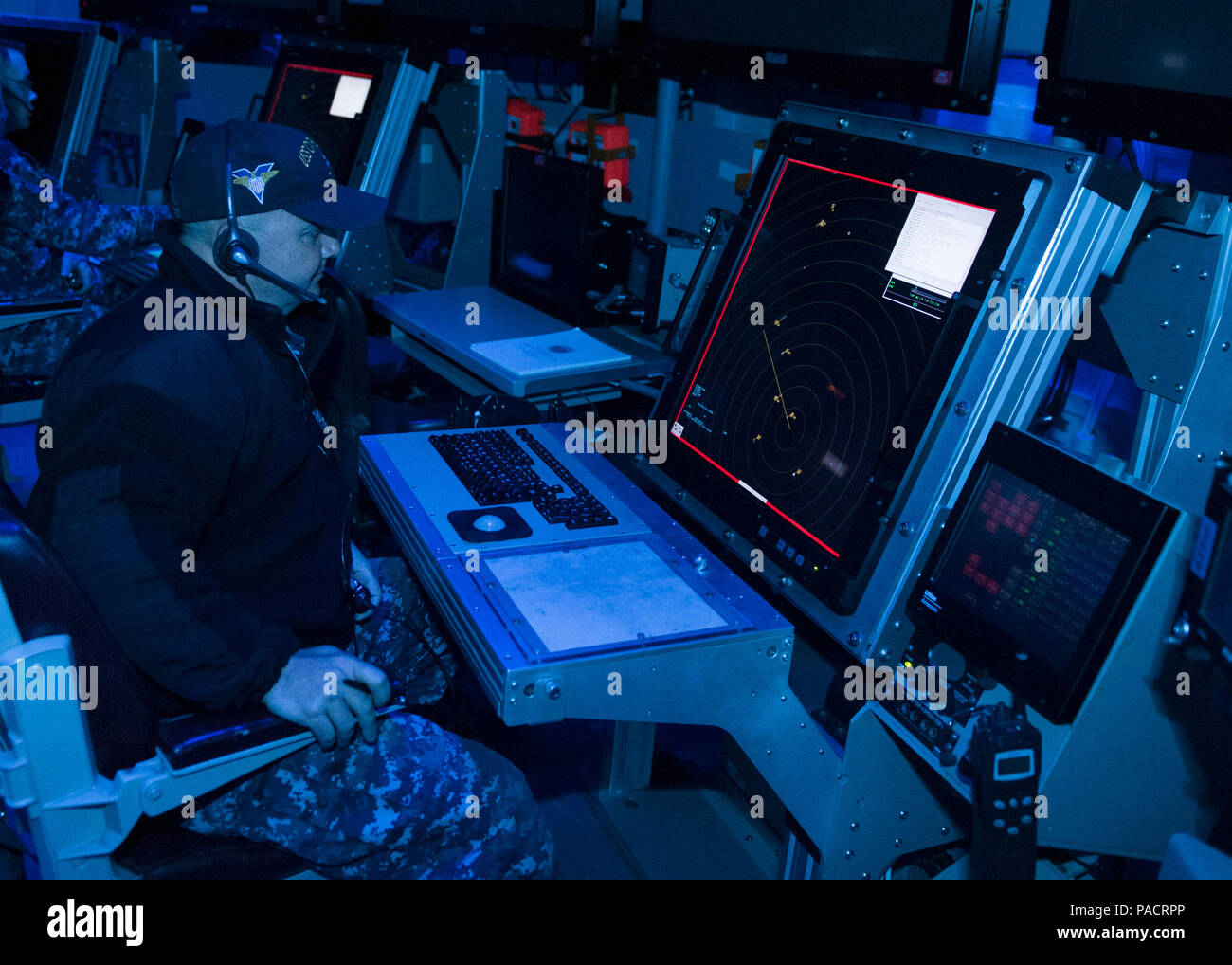160322-N-DI878-097 (March 22, 2016) SAN DIEGO – USS Carl Vinson (CVN 70) Chief Air Traffic Controller Keith Thompson demonstrates the first air traffic control simulator installed on board a Navy aircraft carrier in the aircraft carrier USS Carl Vinson air traffic control center (CATCC). Carl Vinson is currently pierside in its homeport of San Diego. (U.S. Navy photo by Mass Communication Specialist 3rd Class Giovanni Squadrito/Released) Stock Photo