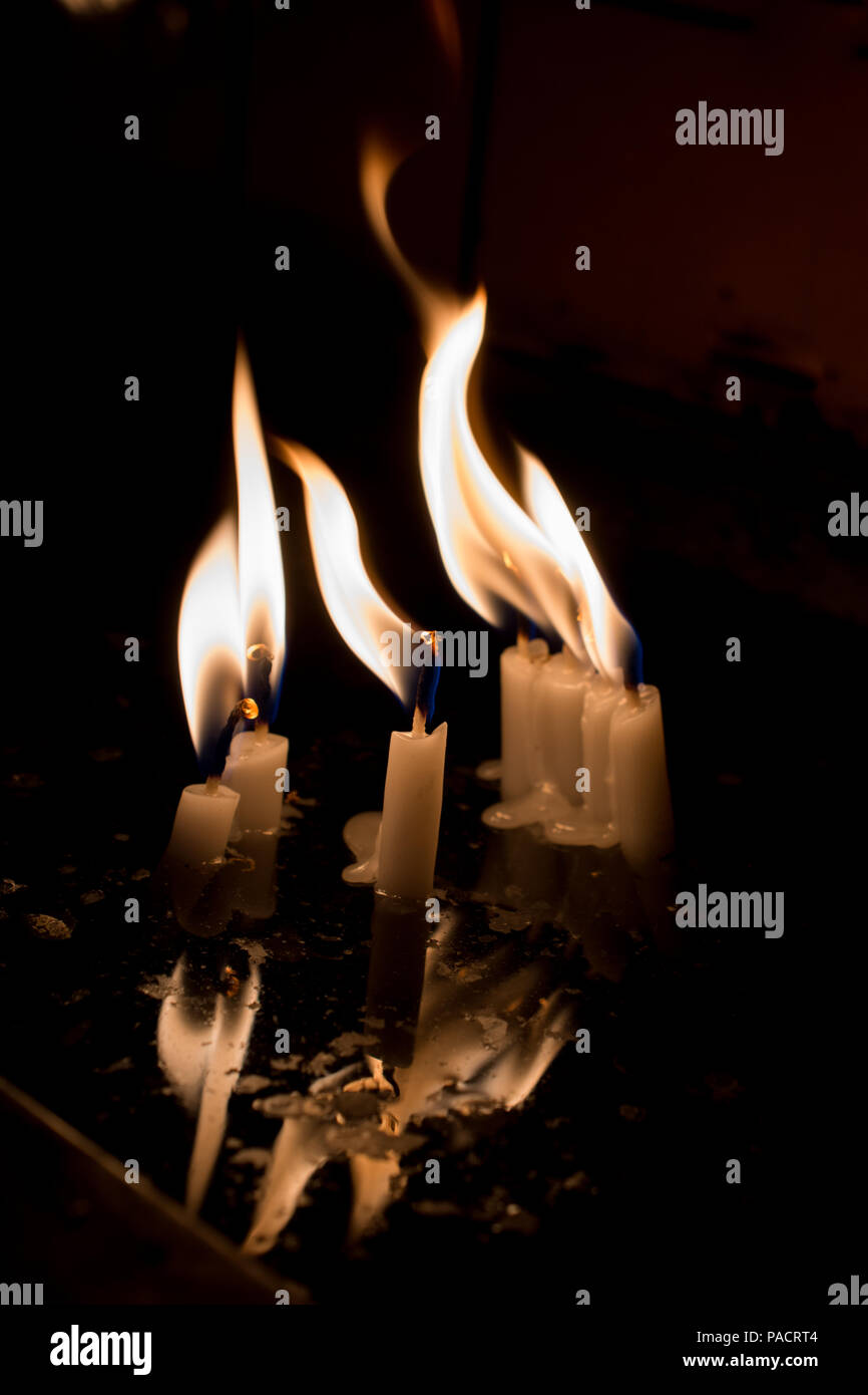 Burning candles with candle light in the dark Stock Photo Alamy