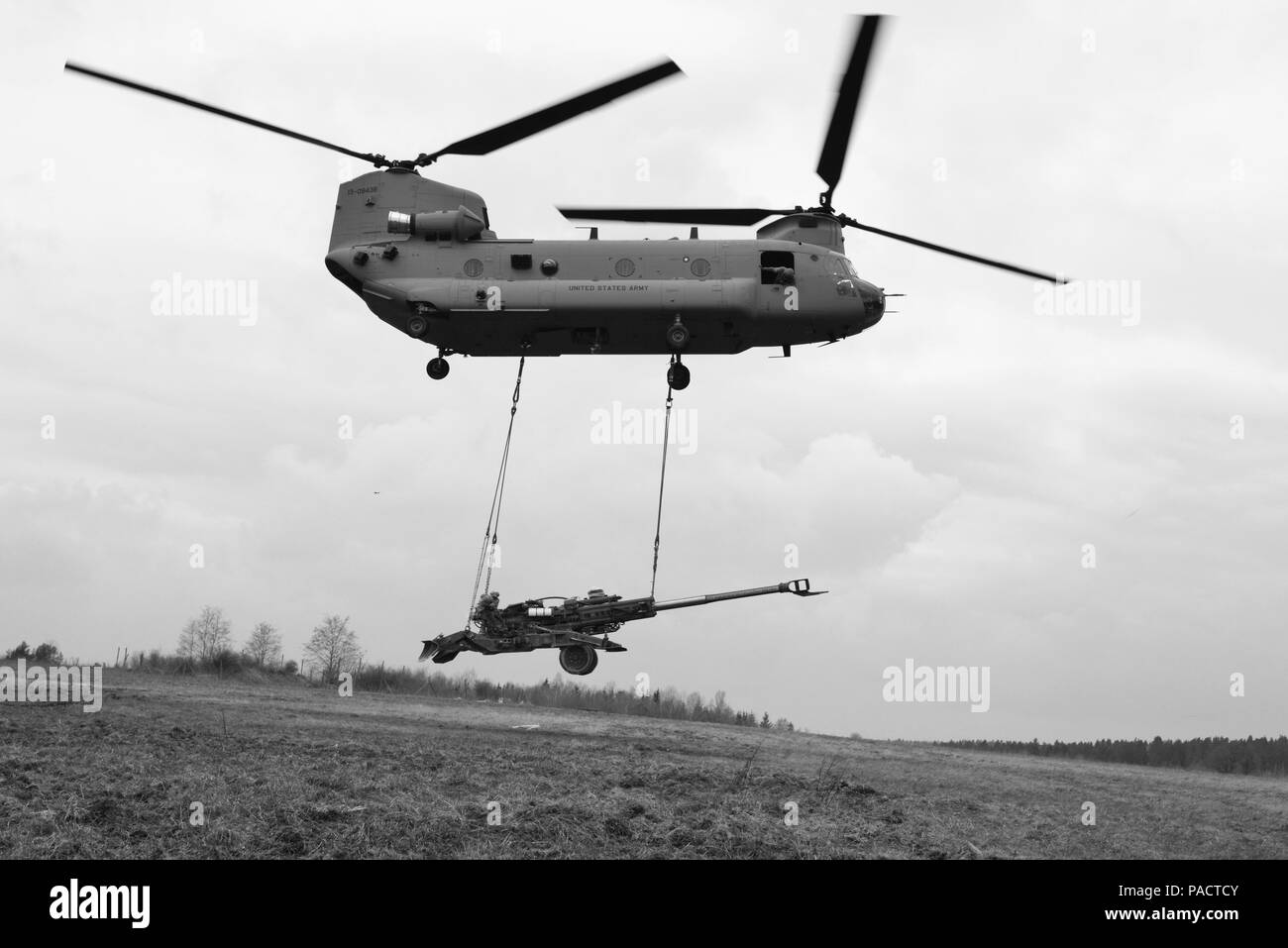 Troopers assigned to Archer Battery, Field Artillery Squadron, 2nd Cavalry Regiment, with support from 12th Combat Aviation Brigade CH-47 Chinook helicopter crews, conduct sling load training with M777 Howitzers as part of the Squadron’s Artillery Systems Cooperation Activities at the 7th Army Joint Multinational Training Command's Grafenwoehr Training Area Germany, March 22, 2016. (U.S. Army photo by Visual Information Specialist Gertrud Zach/released) Stock Photo