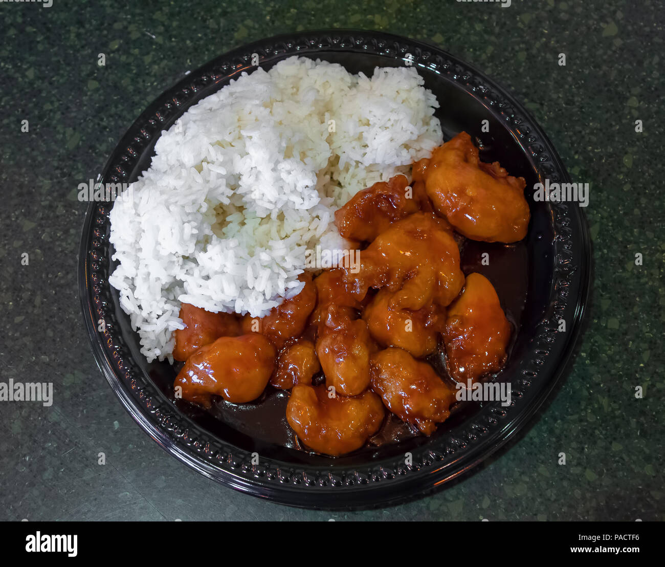 Chinese orange chicken with white rice Stock Photo - Alamy