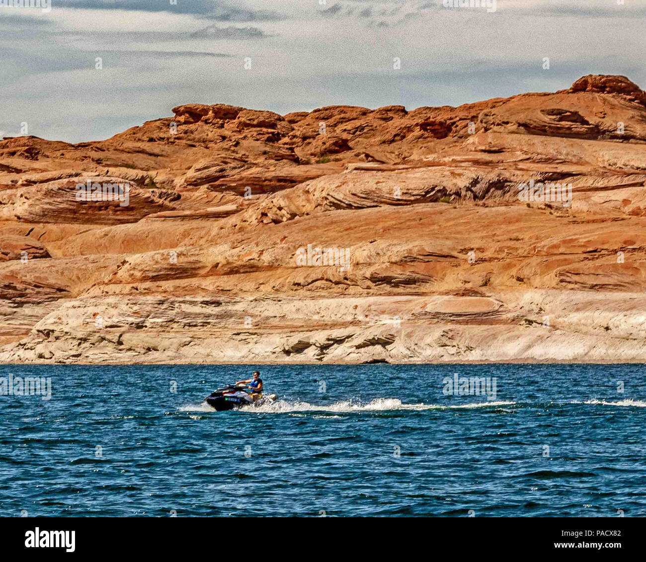 Arizona Usa 31st May 2018 A Vacationer Jet Skiing In Colorful Antelope Slot Canyon A Narrow Curving High Walled Side Arm Of Lake Powell And A Favorite Tourist Attraction The Towering Navajo Sandstone