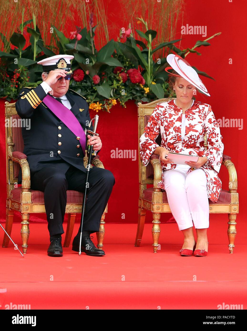 Belgian Prince Laurent (L) is pictured with Princess Claire (R) and her  daughter Princess Louise on the podium during the military parade on the  occasion of Belgium?s National Day in Brussels, Belgium