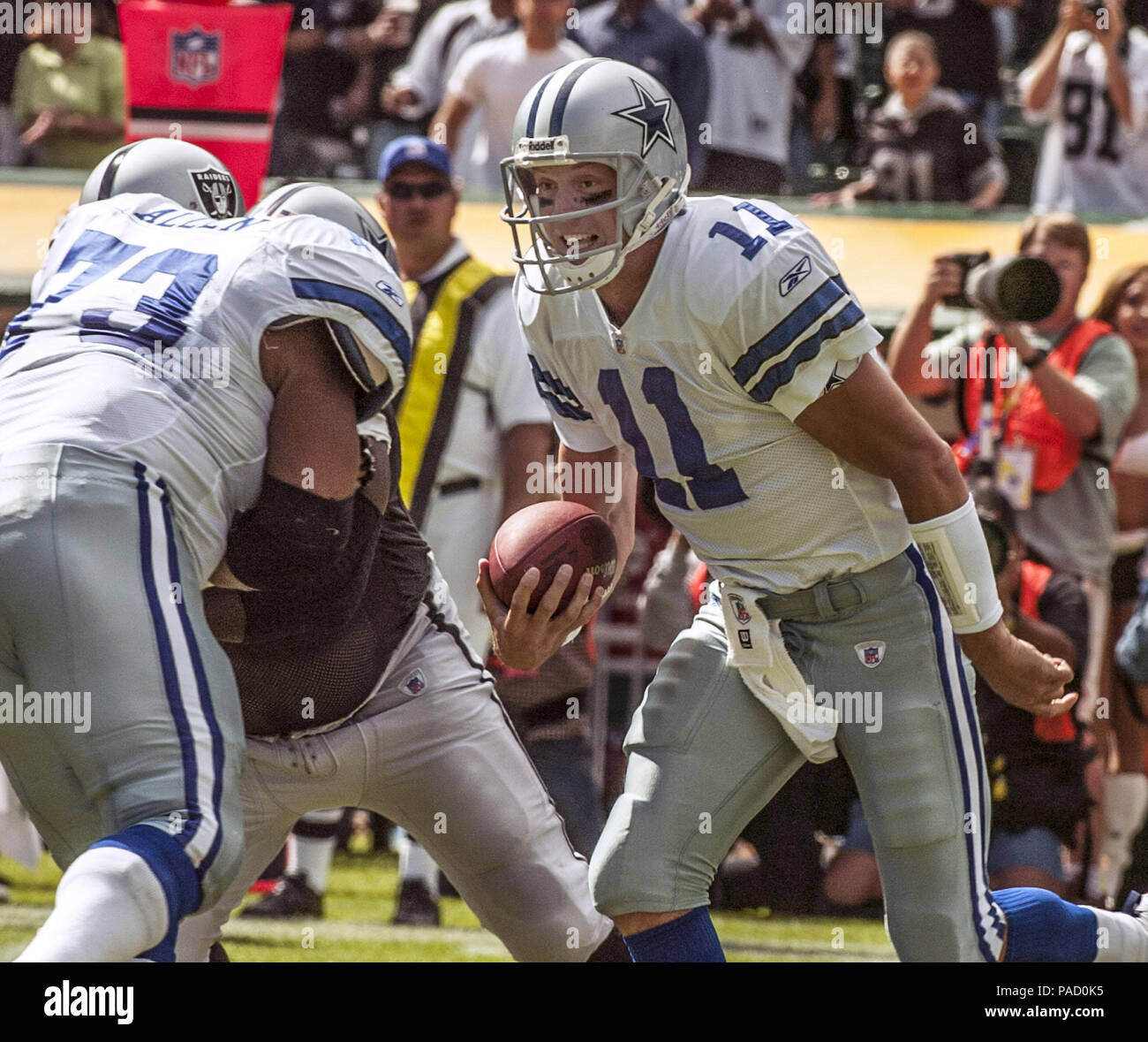 Dallas Cowboys quarterback Drew Bledsoe is sacked by Washington Redskins'  Walt Harris (27) and Chris lemons (