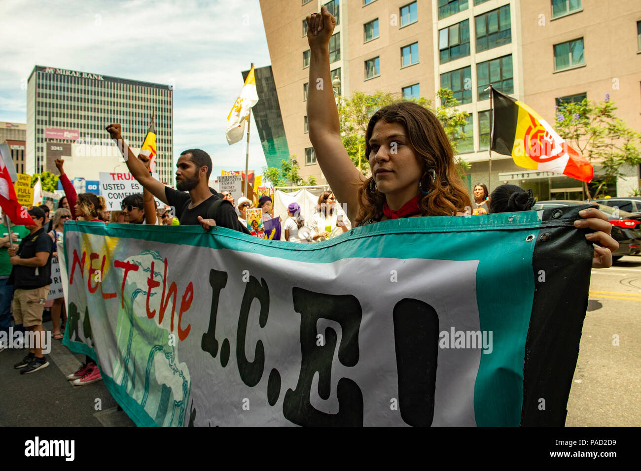 Los Angeles, USA. 21 July 2018.  Families Belong Together March and ICE (Immigration and Customs Enforcement protest in Los Angeles, California on July 21, 2018. Protesters carrying banner which is 'melt the ice' writtem on while lifting arms in unity. Despite the ending of family separations at US borders many children that were taken away from their parents are still not re-united with their families. Credit: Aydin Palabiyikoglu Credit: Aydin Palabiyikoglu/Alamy Live News Stock Photo