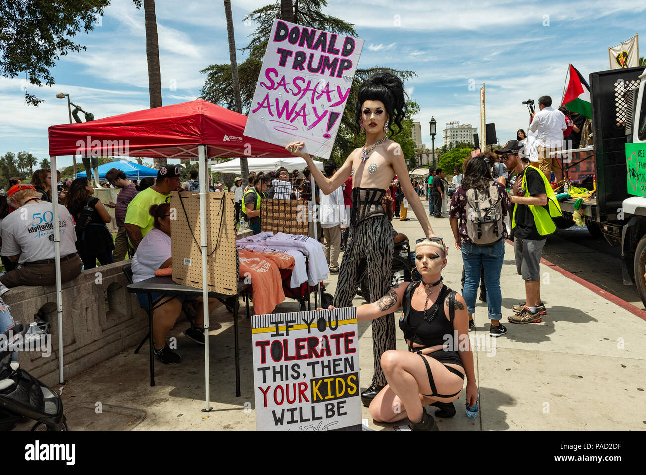 Los Angeles, USA. 21 July 2018.  Families Belong Together March and ICE (Immigration and Customs Enforcement protest in Los Angeles, California on July 21, 2018. Protesors holding signs at Rally polint at McArthur park. Despite the ending of family separations at US borders many children that were taken away from their parents are still not re-united with their families. Credit: Aydin Palabiyikoglu Credit: Aydin Palabiyikoglu/Alamy Live News Stock Photo