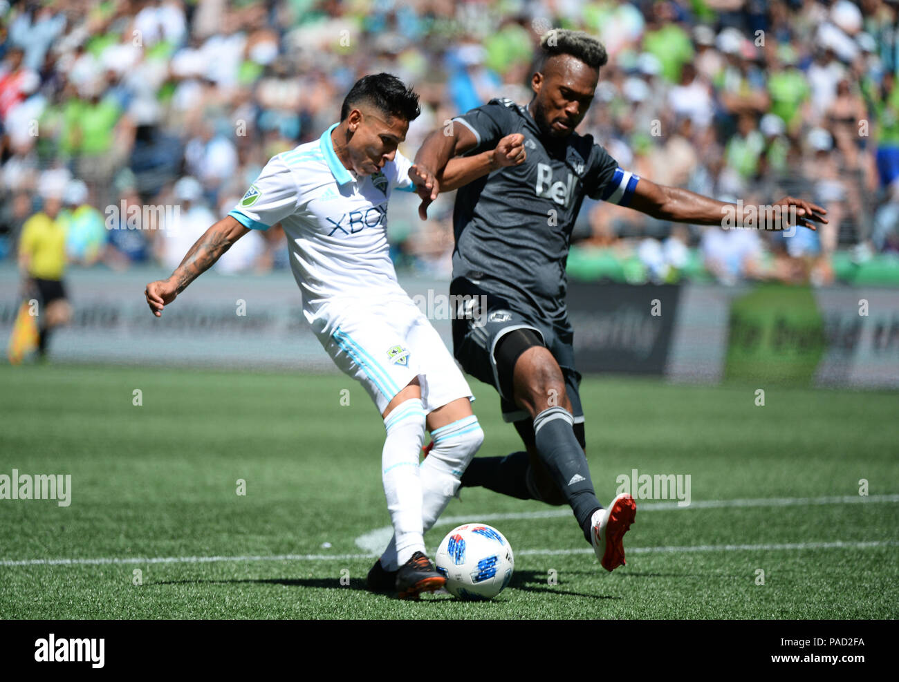 Seattle, Washington, USA. 21st July, 2018. RAUL RUIDIAZ (9) takes a shot against the defense of KENDALL WASTON (4) as the Vancouver Whitecaps visit the Seattle Sounders for an MLS match at Century Link Field in Seattle, WA. Credit: Jeff Halstead/ZUMA Wire/Alamy Live News Stock Photo