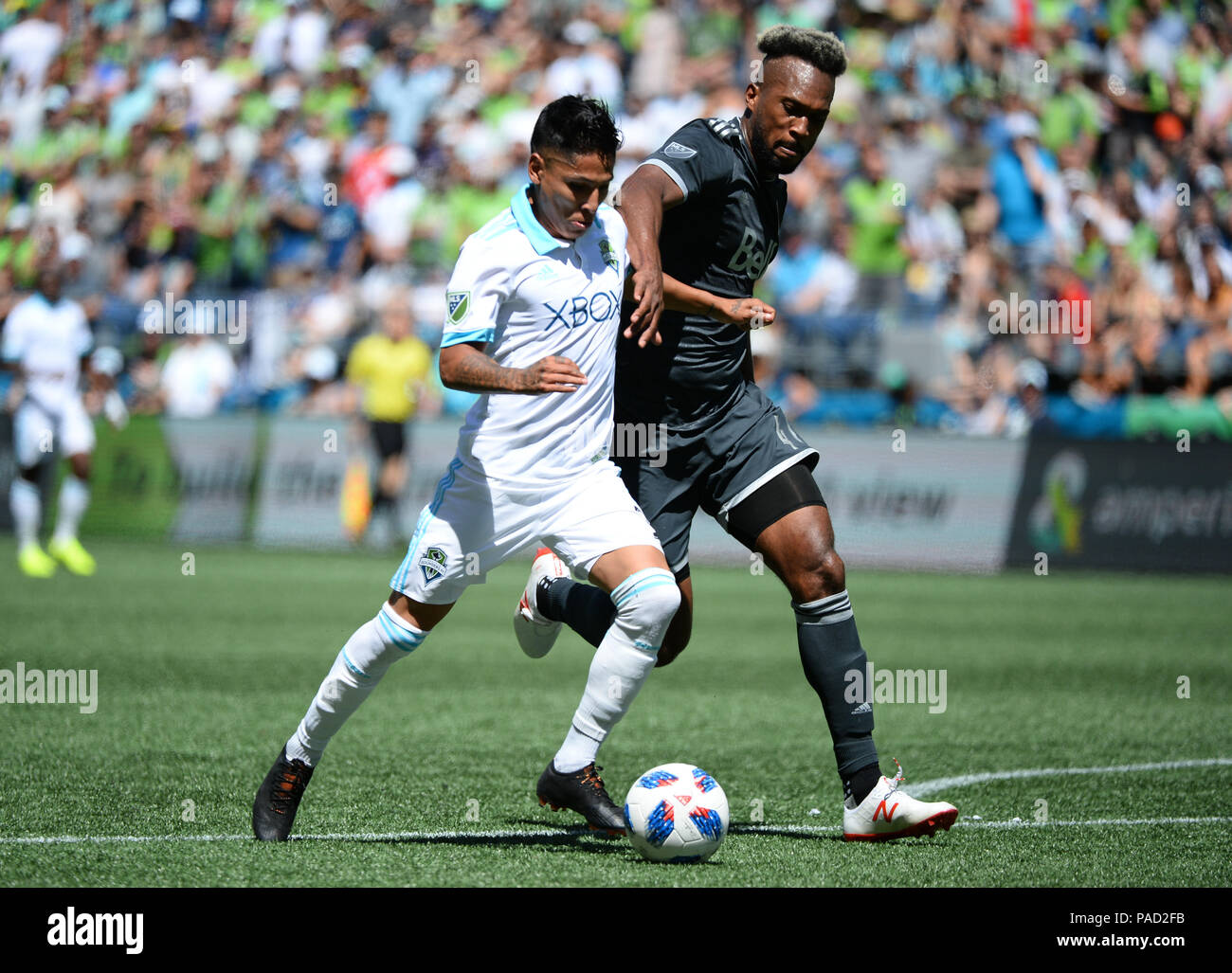 Seattle, Washington, USA. 21st July, 2018. The Whitecaps KENDALL WASTON (4) defends against recently signed RAUL RUIDIAZ (9) as the Vancouver Whitecaps visit the Seattle Sounders for an MLS match at Century Link Field in Seattle, WA. Credit: Jeff Halstead/ZUMA Wire/Alamy Live News Stock Photo