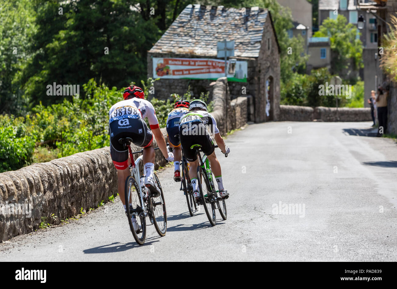Pont-de-Montvert-Sud-Mont-Lozere, France - July 21, 2018: Rear view of the breakaway descending a road in Occitan region during the stage 14 of Tour de France 2018. Credit: Radu Razvan/Alamy Live News Stock Photo