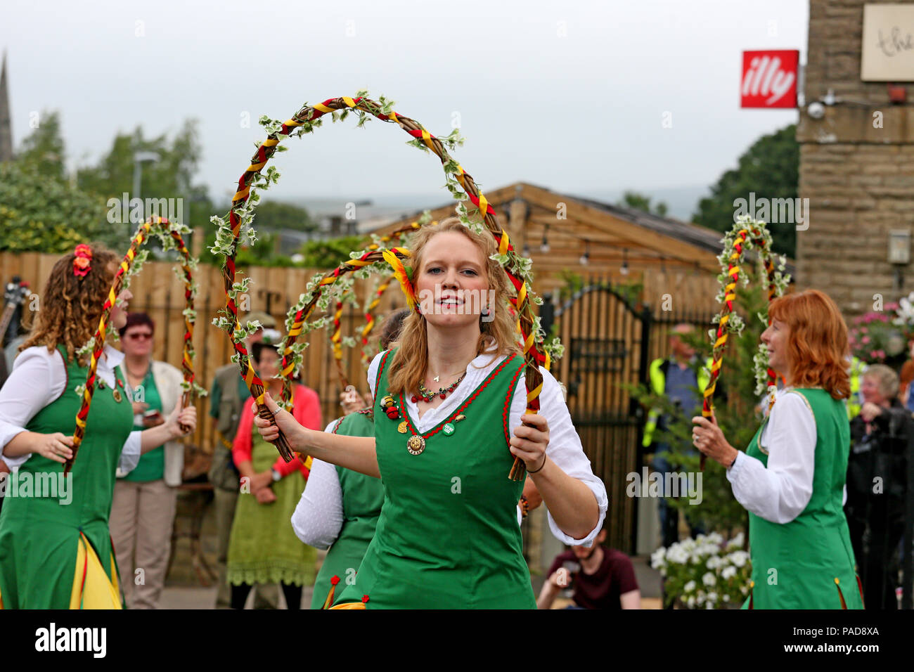 Littleborough, UK. 22nd July, 2018. Chelmsford Morris Green at the annual Rushbearing festival reviving the tradition of carrying the rushes to the local church dating back to a time when the church floors where earthen and the rushes were used to cover them for insulation. Littleborough,22nd July, 2018 (C)Barbara Cook/Alamy Live News Credit: Barbara Cook/Alamy Live News Stock Photo