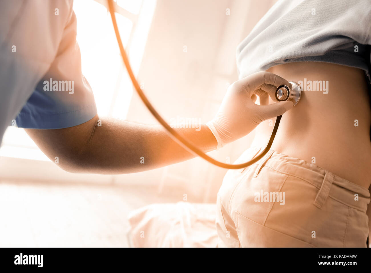Professional medic examining patient hi-res stock photography and ...