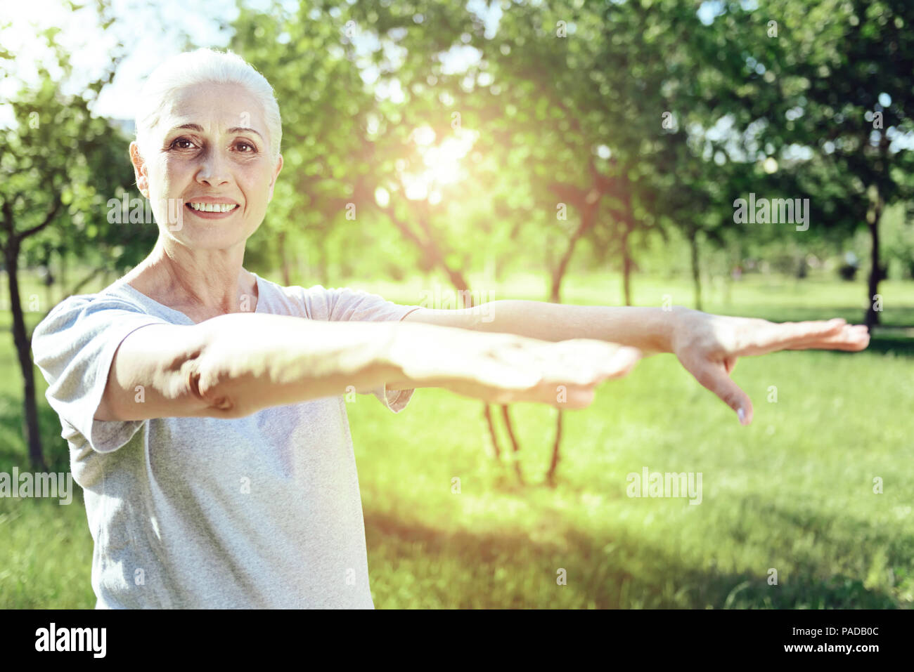 Elderly woman enjoying a nice sunny day Stock Photo - Alamy