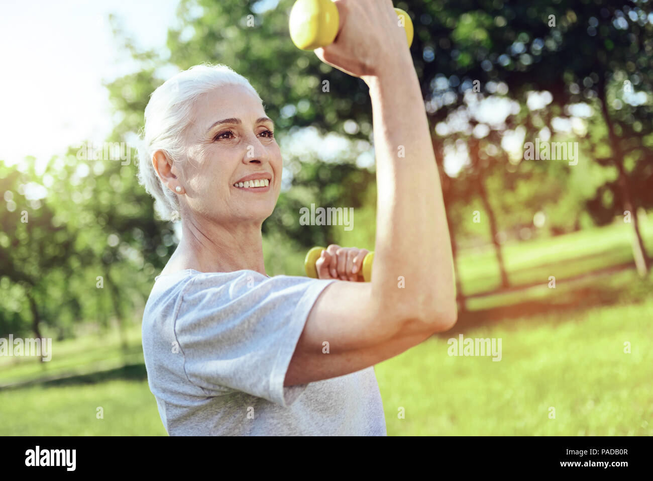 Strong active pensioner enjoying her trainings Stock Photo