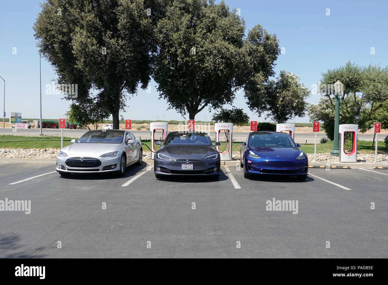 Tesla Supercharging Stations at Harris Ranch, a popular stop over on Interstate 5 in California's Central Valley. Stock Photo
