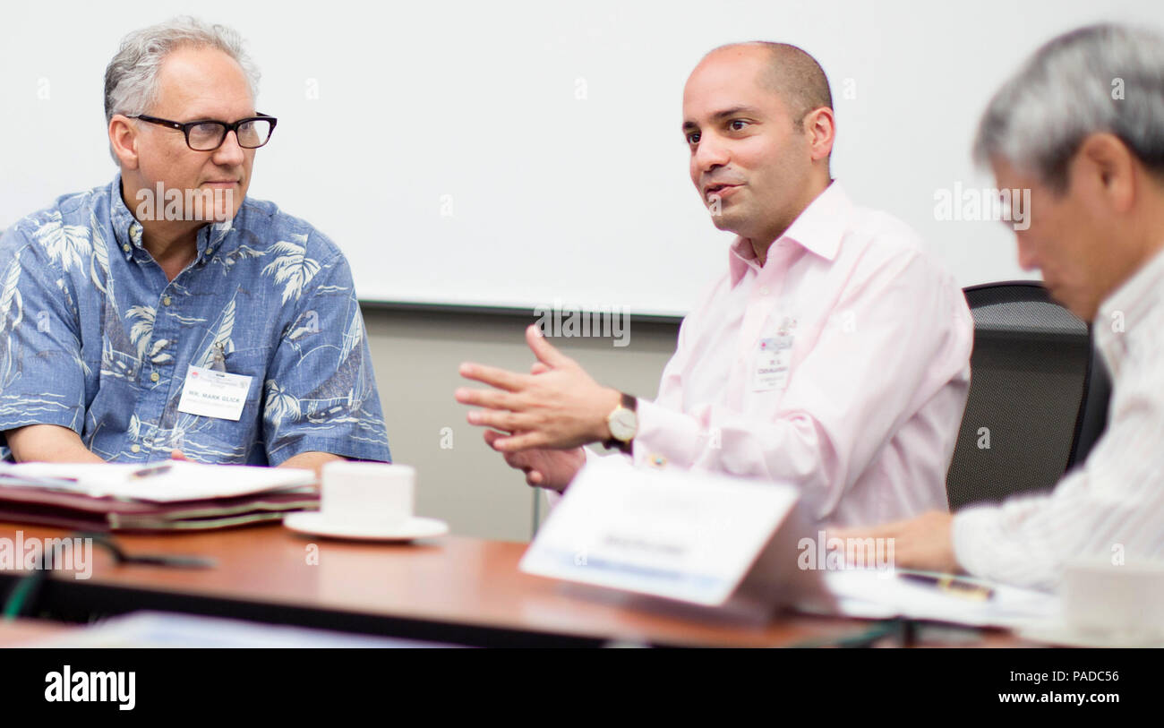 Ali Izadi-Najafabadi, with Bloomberg New Energy Finance, shares his perspective on alternative energy issues in a seminar session during the March 21 renewable energy workshop at the Daniel K. Inouye Asia-Pacific Center for Security Studies. At right of Izadi-Najafabadi is fellow workshop participant Mark Glick, with Hawaii’s State Energy Office.  Looking to enhance energy security through bilateral cooperation, 24 U.S. and Japanese government, corporate, non-profit and academic professionals gathered at the Daniel K. Inouye Asia-Pacific Center for Security Studies for a workshop March 21.  DK Stock Photo