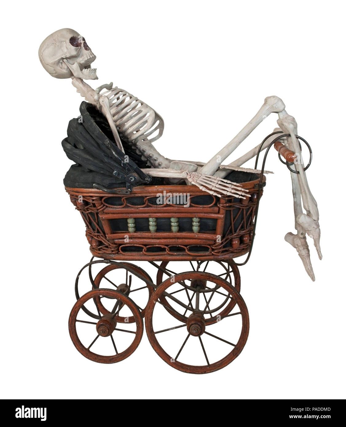 Skeleton in a Vintage bassinet with folding cover and handle - path included Stock Photo
